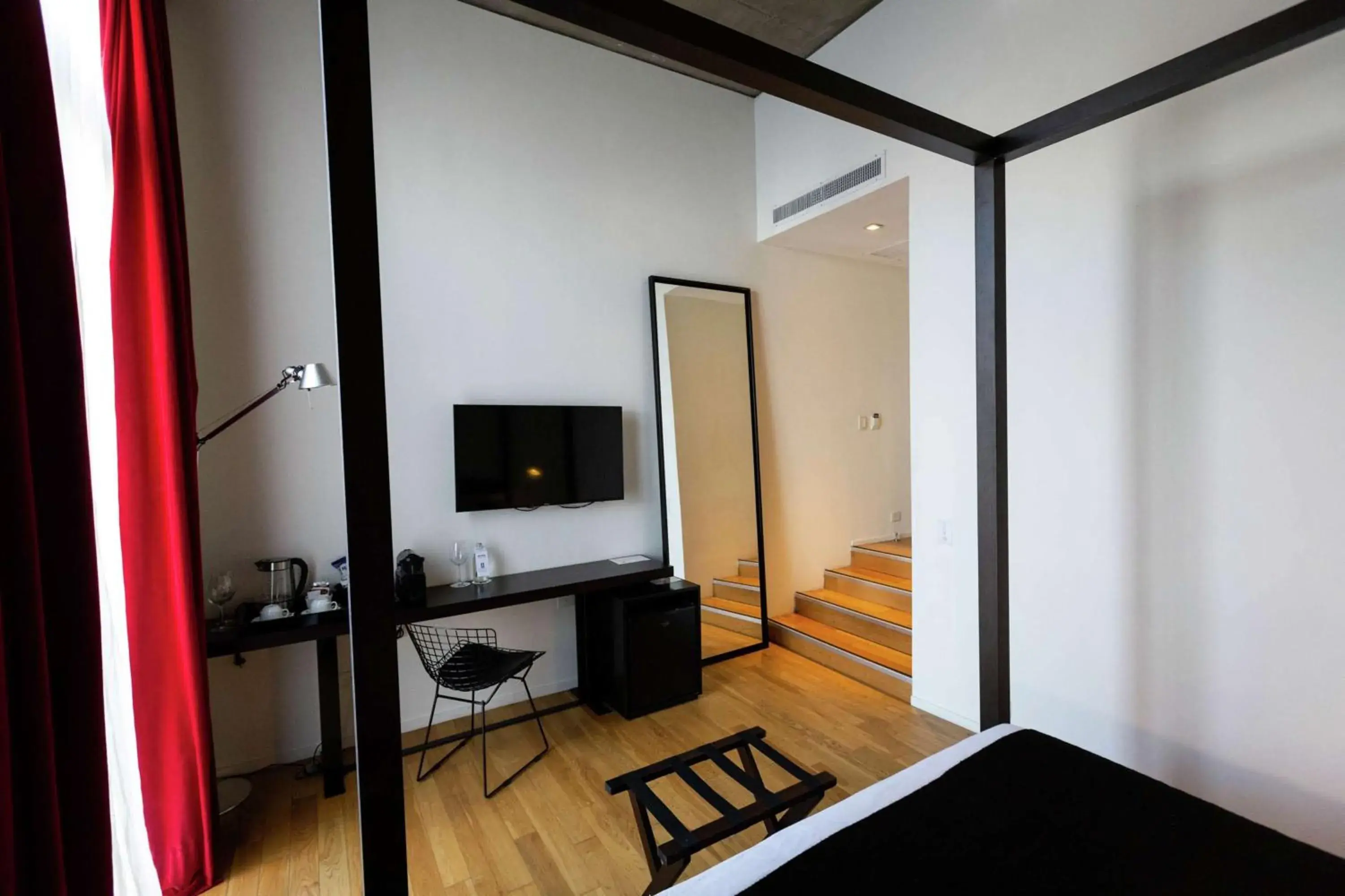 Bed, TV/Entertainment Center in Anselmo Buenos Aires, Curio Collection By Hilton