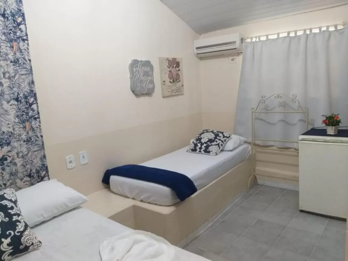 Bed in Pousada Dois Rios