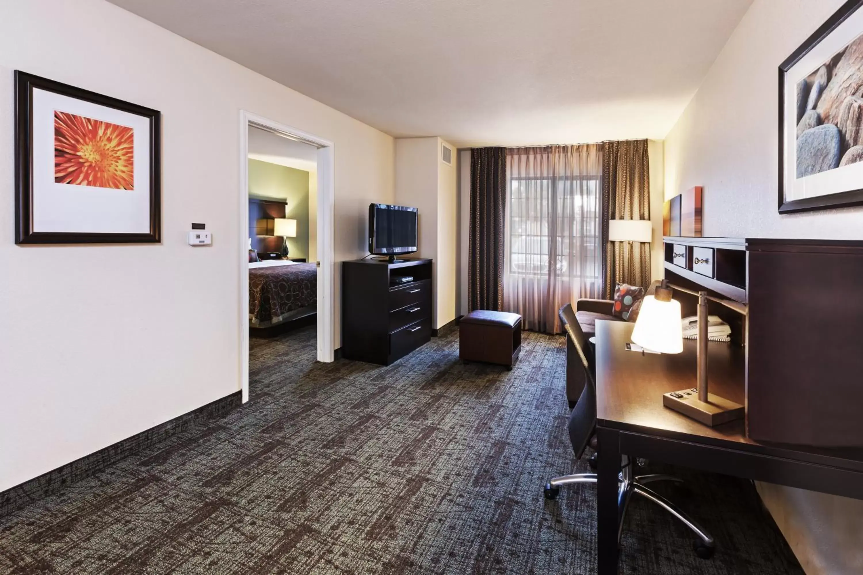 Photo of the whole room, TV/Entertainment Center in Staybridge Suites Tulsa-Woodland Hills, an IHG Hotel