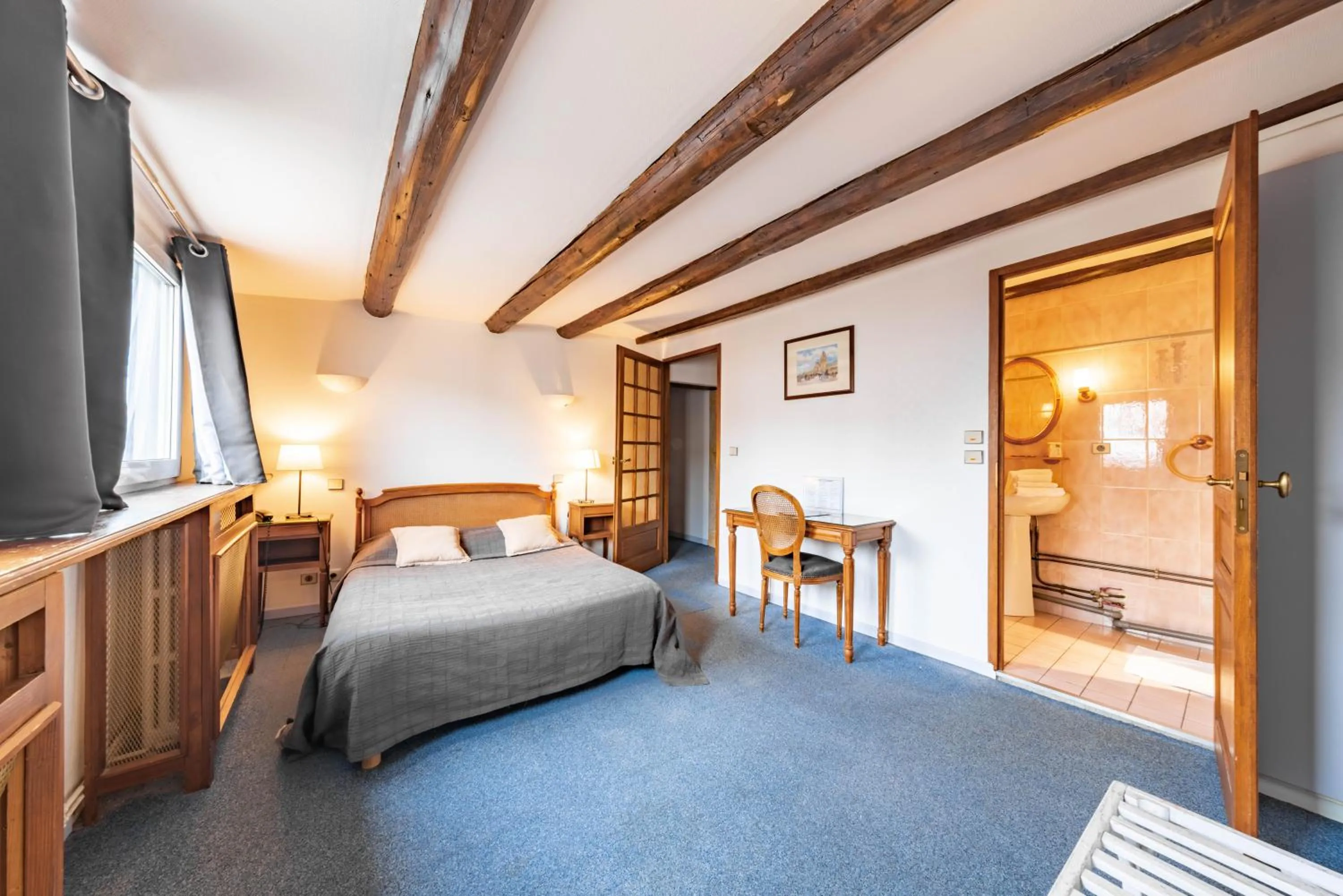 Bedroom in Hôtel du Centre