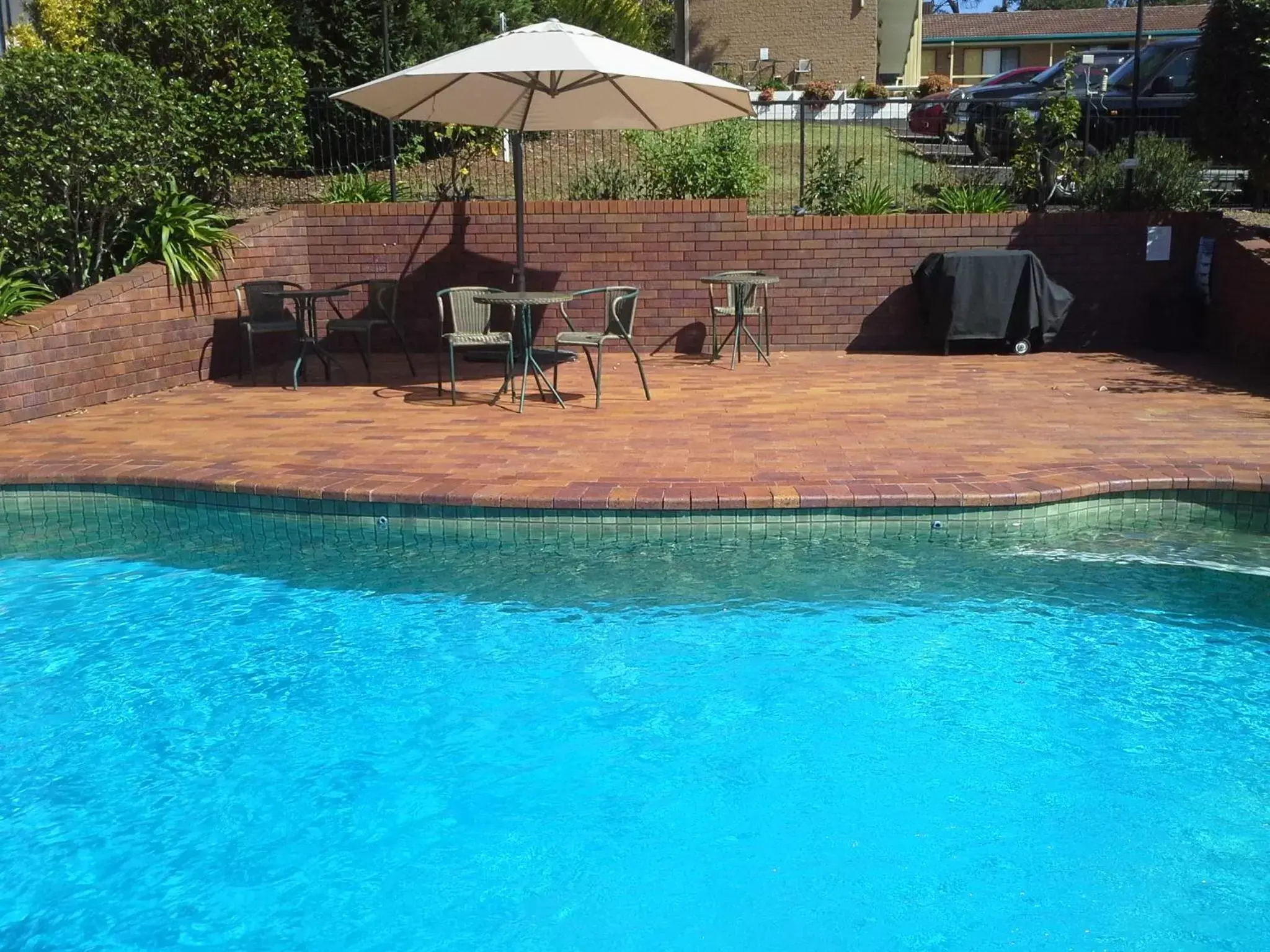 Patio, Swimming Pool in Hideaway Motor Inn