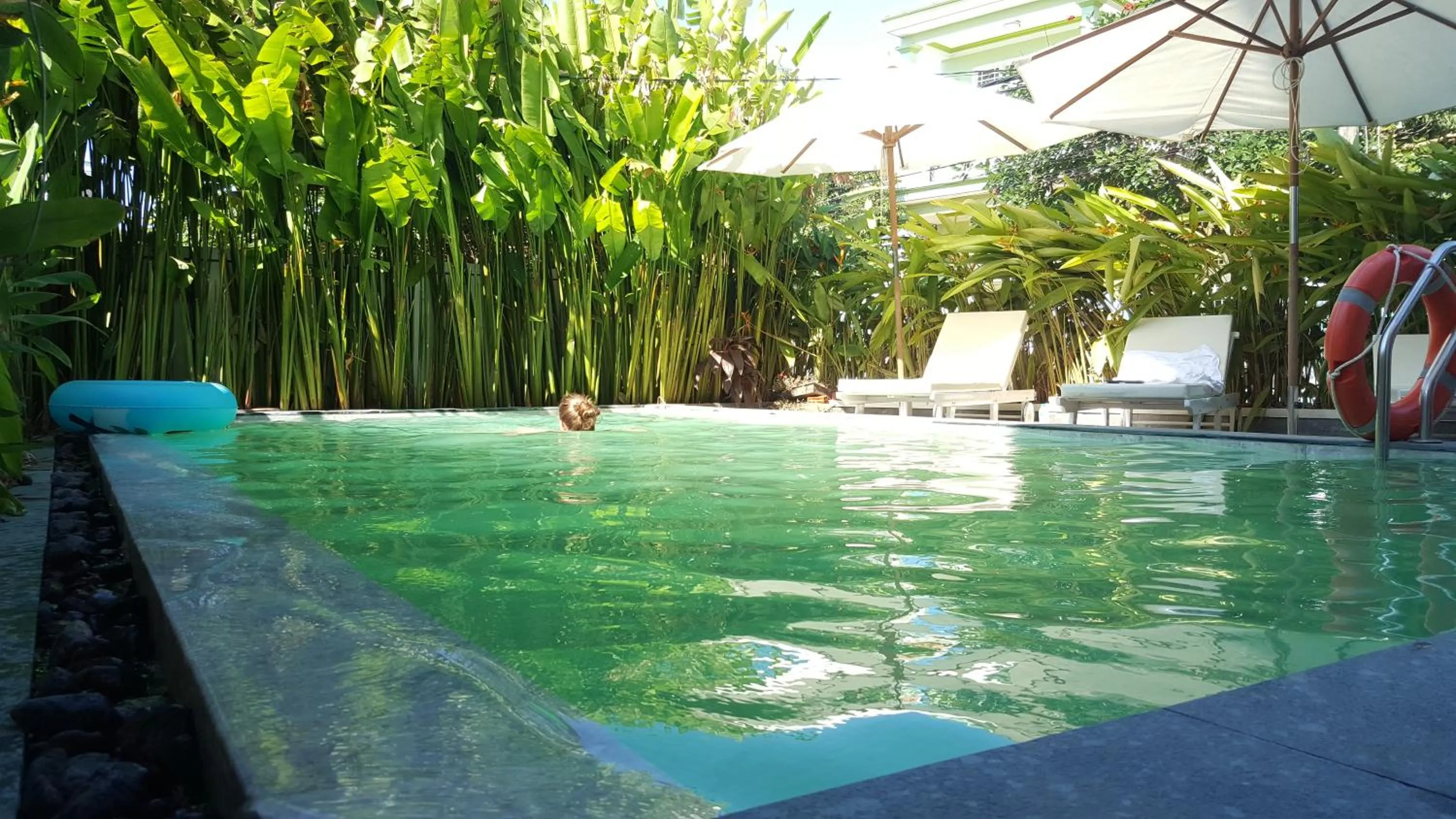 People in Flamingo Villa Homestay - Big Rooms with Balcony - Close to Hoi An Old Town 200m & Temple Bridge - Large Outside Pool for Sun Bathing