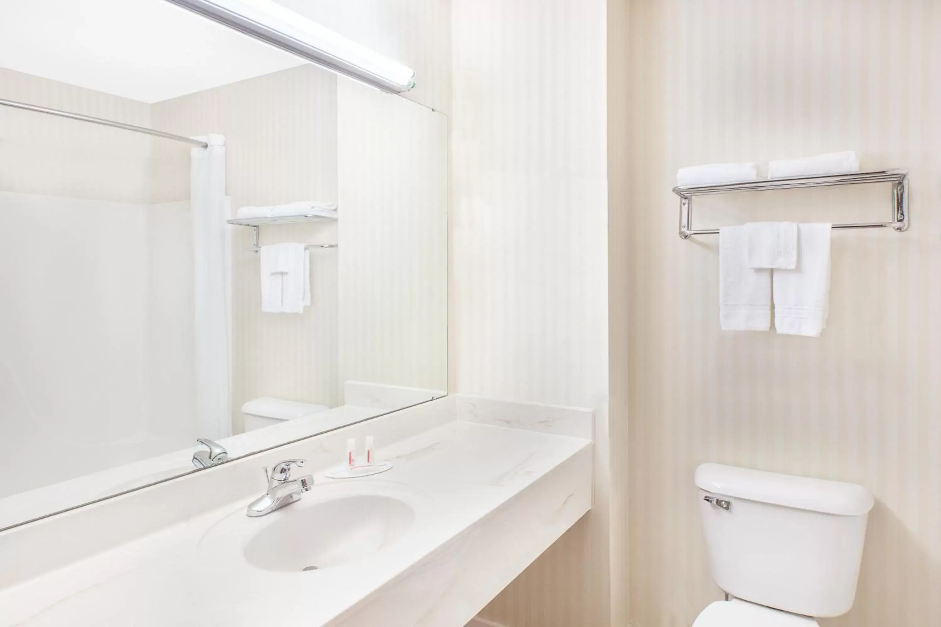 Toilet, Bathroom in Super 8 by Wyndham Lowell/Bentonville/Rogers Area