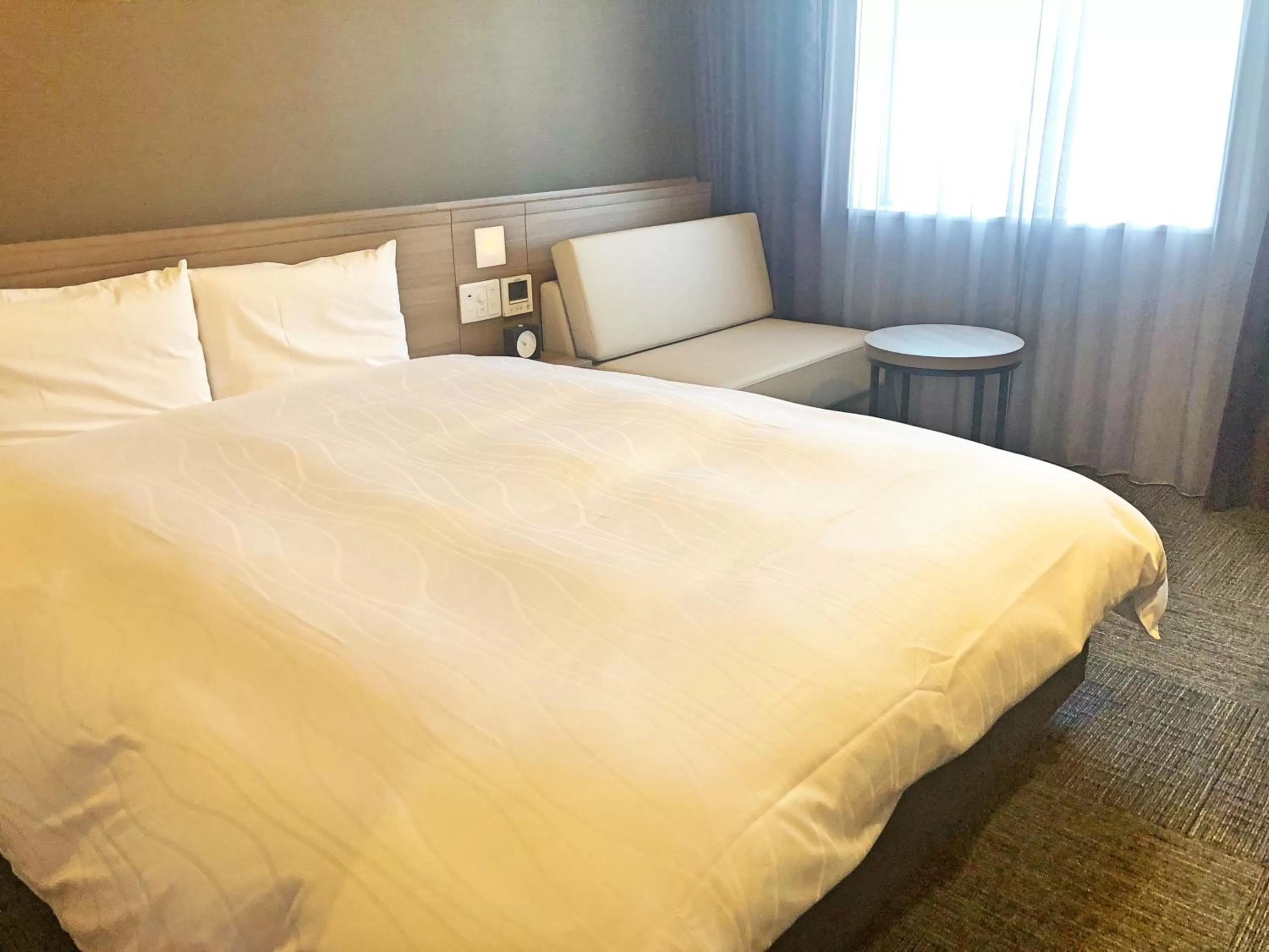 Bed in La Vista Furano Hills Natural Hot Spring