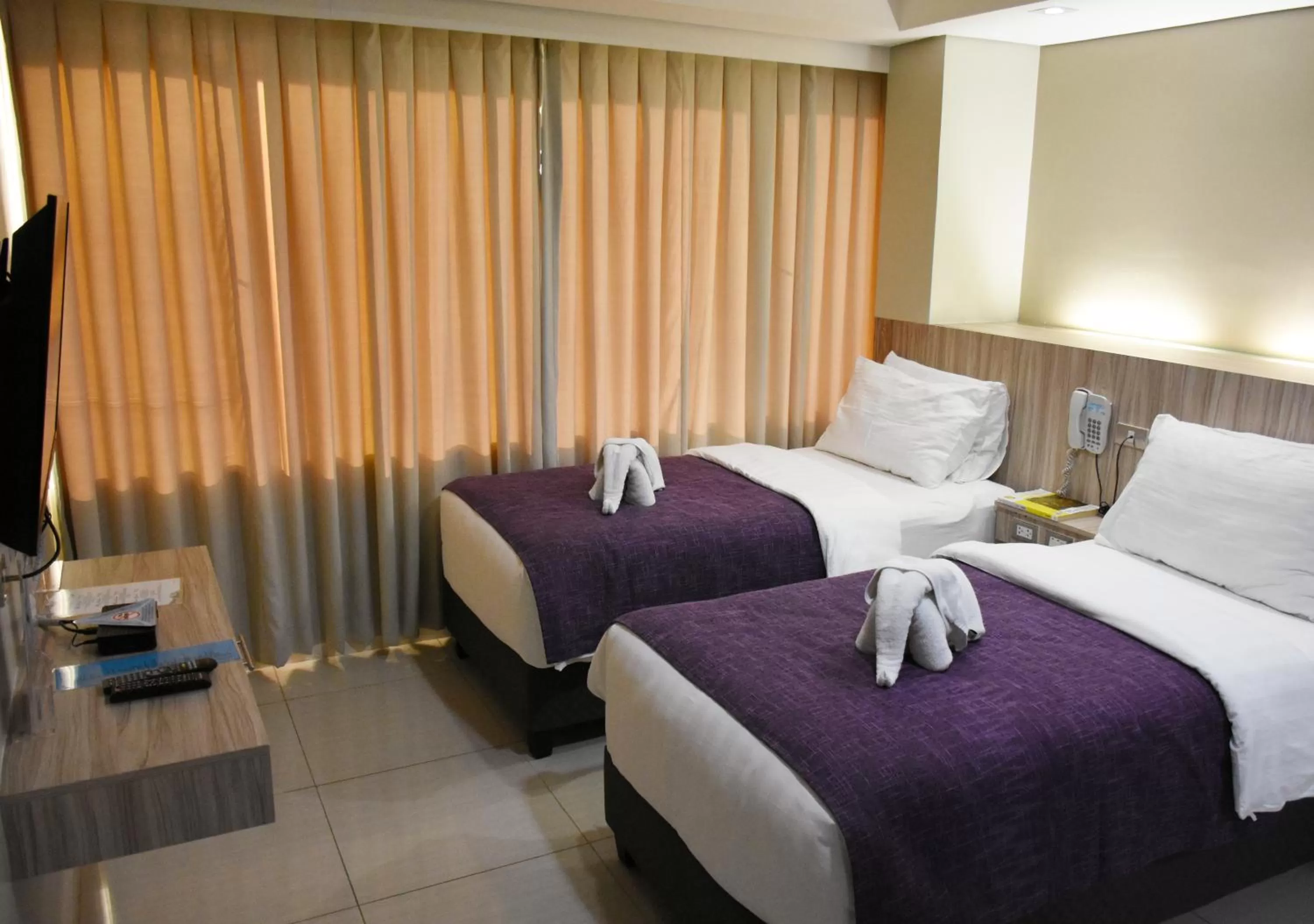 Bed in Alicia Apartelle