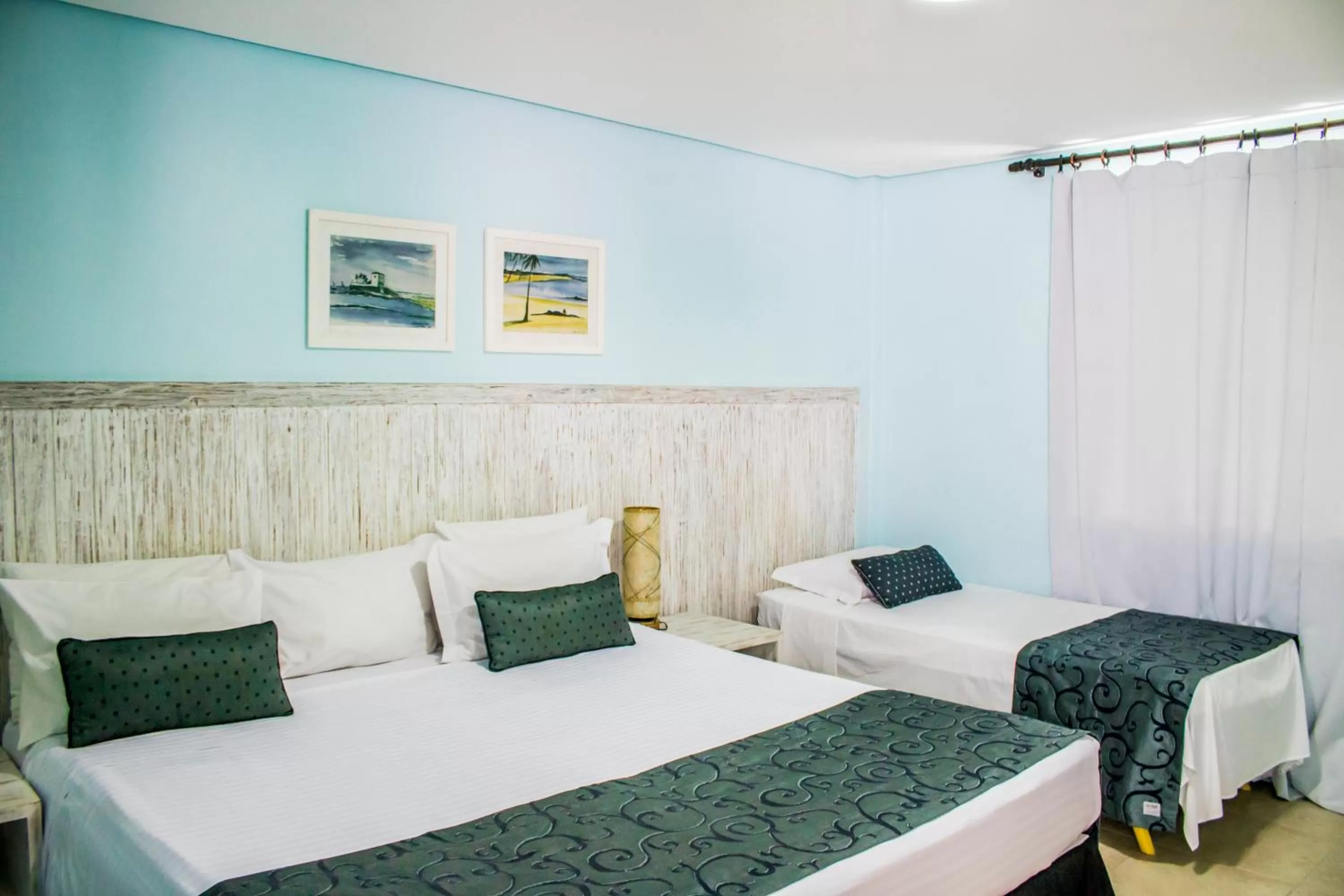 Bed in Farol de Itapuã Praia Hotel