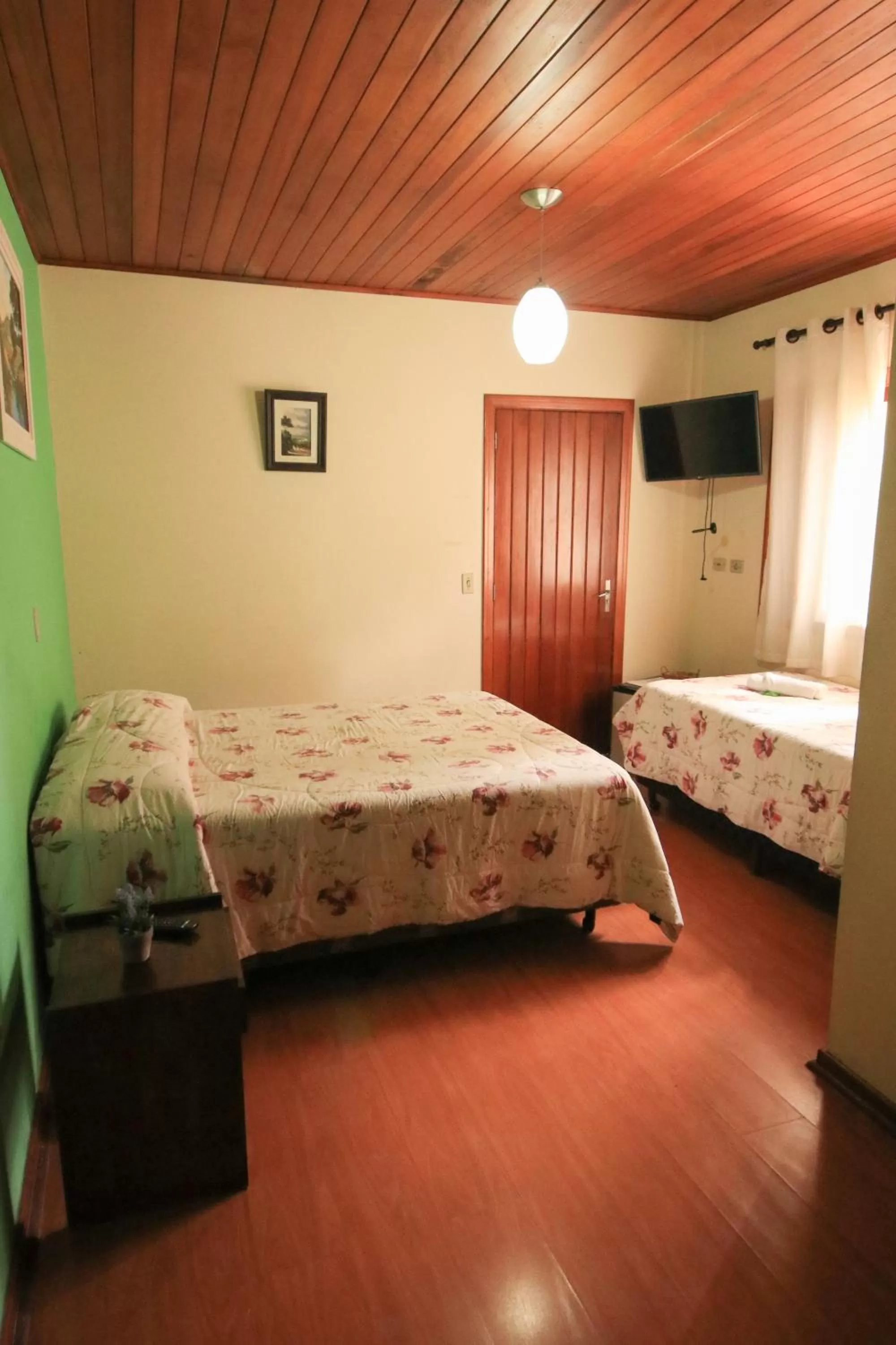 Bed in Pousada Curumi