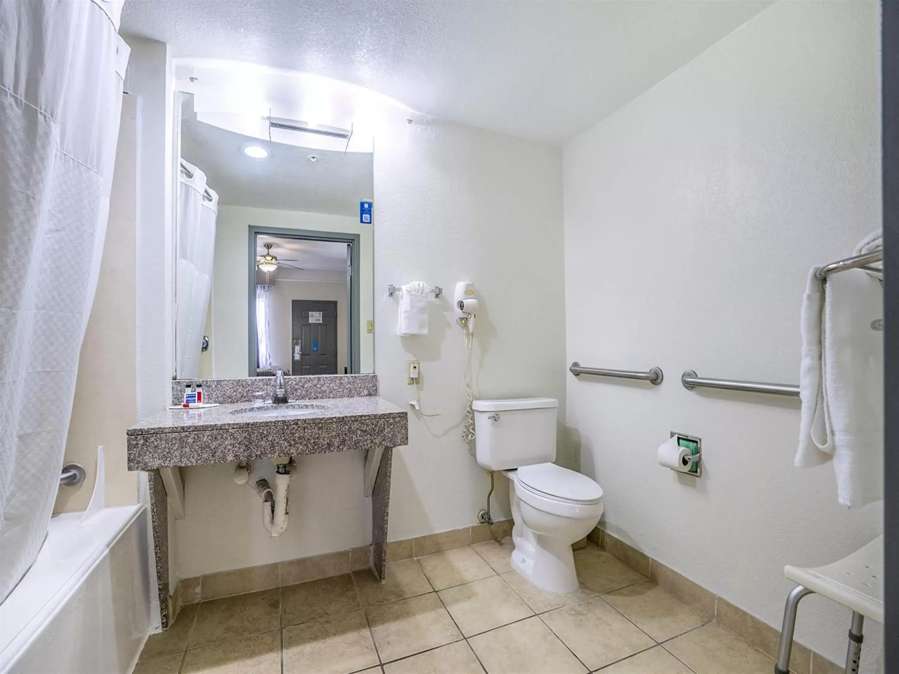 Bathroom in Days Inn & Suites by Wyndham Webster NASA-ClearLake-Houston