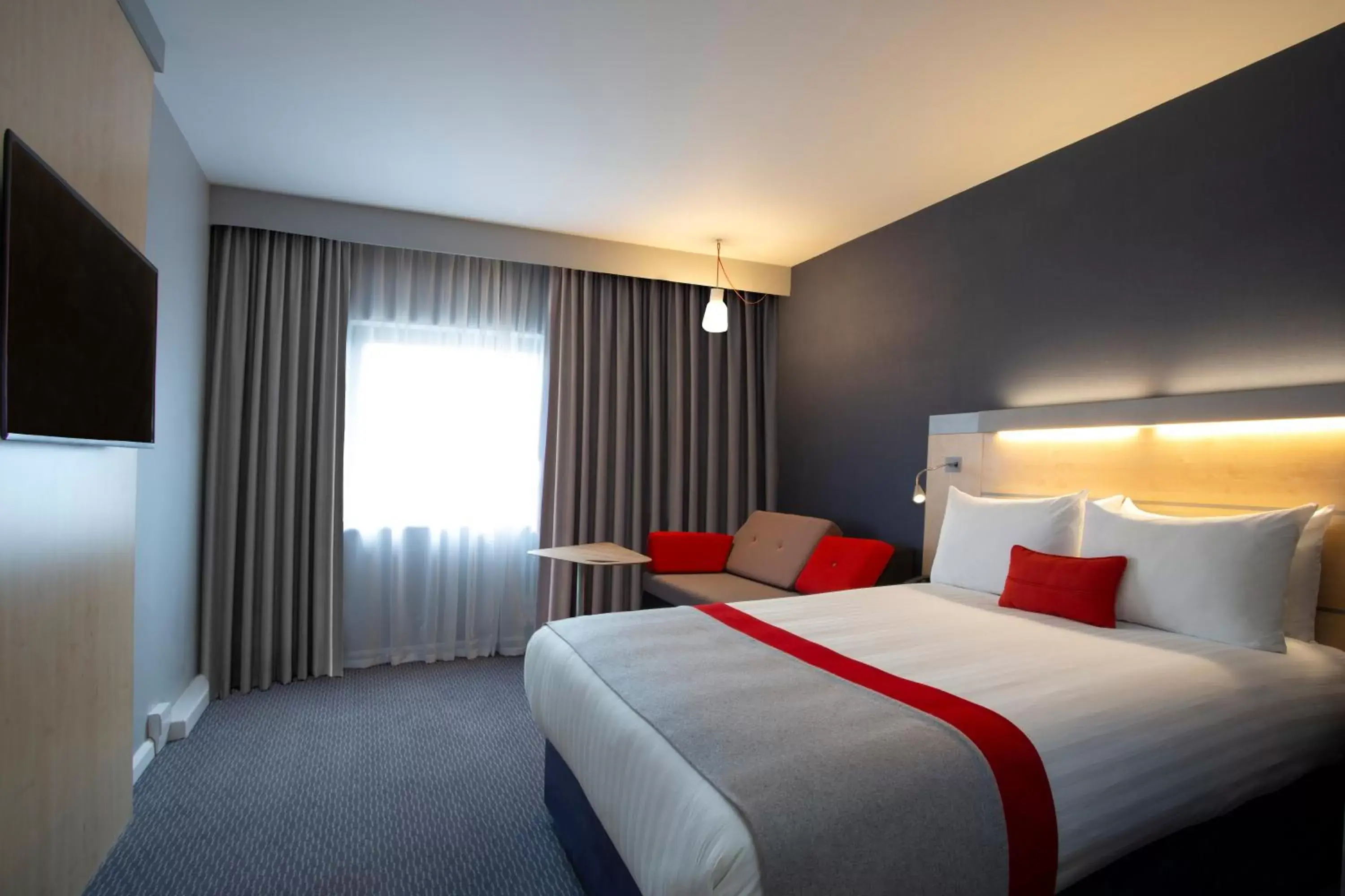 Bed in Holiday Inn Express Cheltenham Town Centre, an IHG Hotel