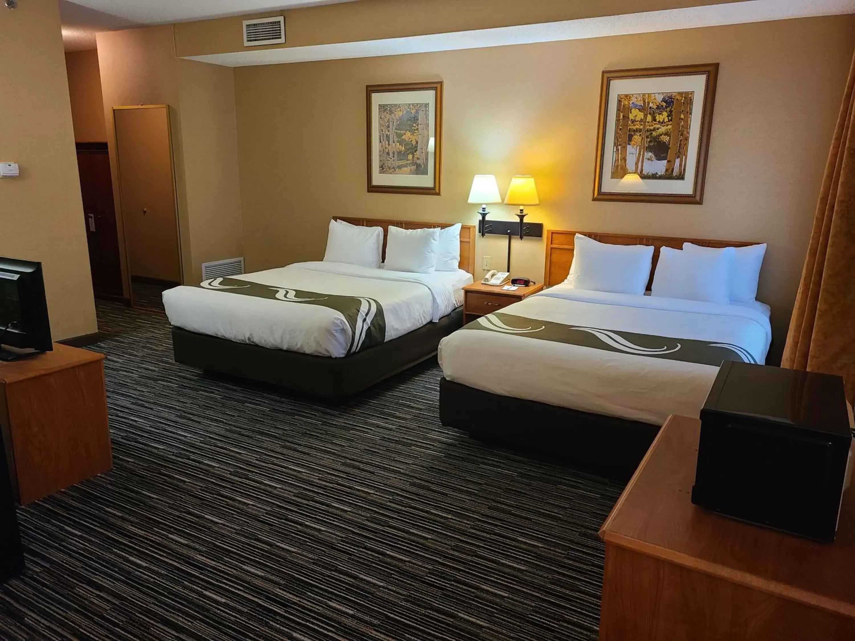 Bed in Quality Inn & Suites Wellington – Fort Collins