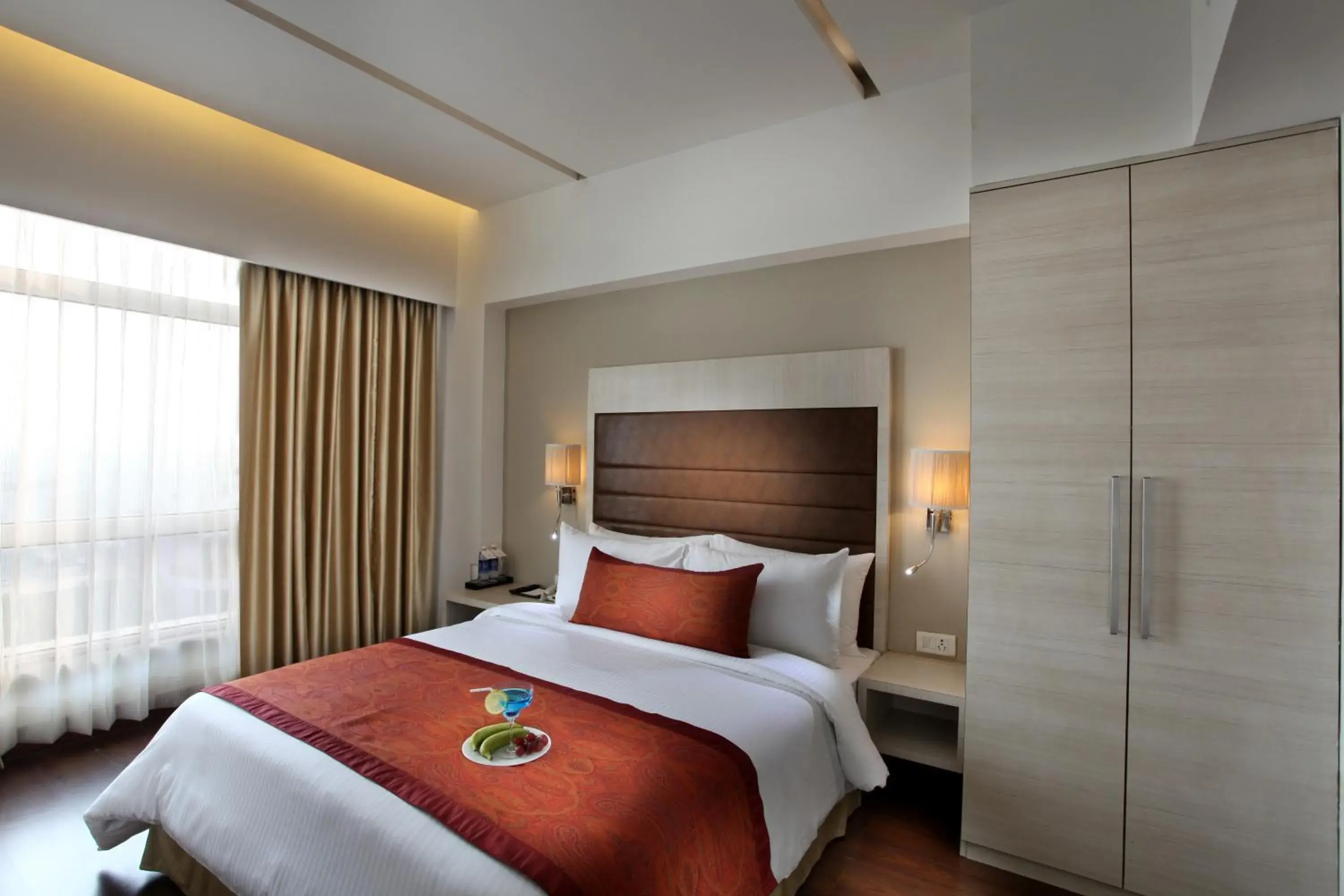 Bed in Mahagun Sarovar Portico Suites Ghaziabad