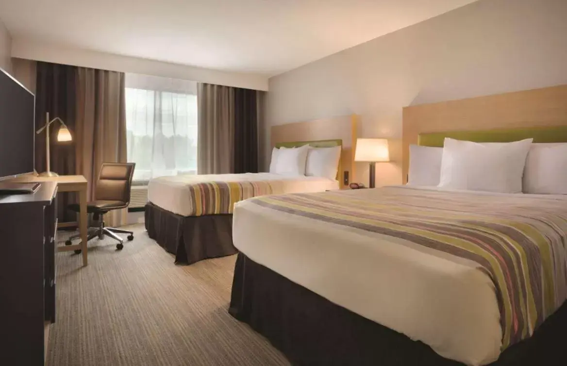 Bed in Country Inn & Suites by Radisson, Tampa RJ Stadium