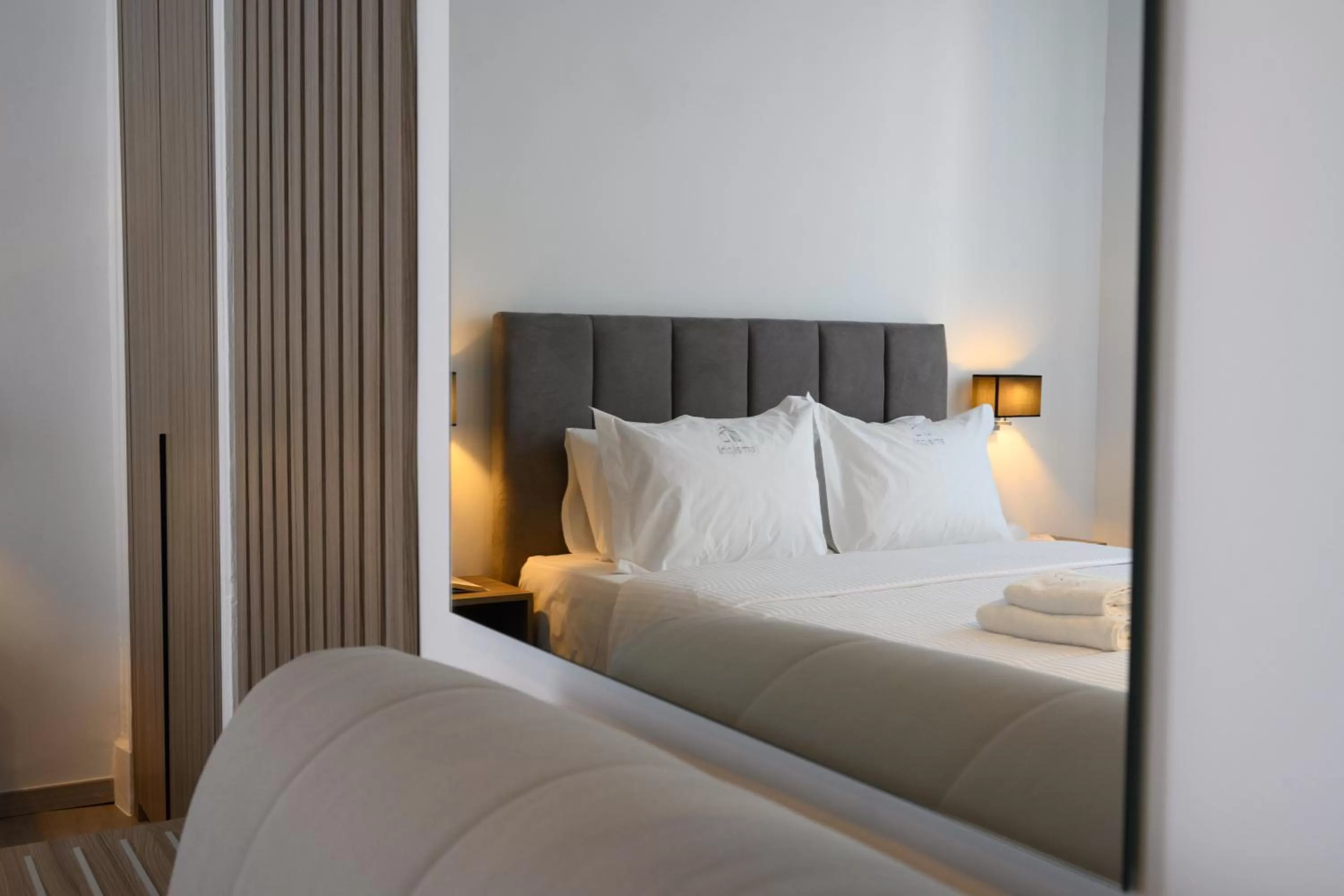 Bed in AMALPHI Corfu City Living