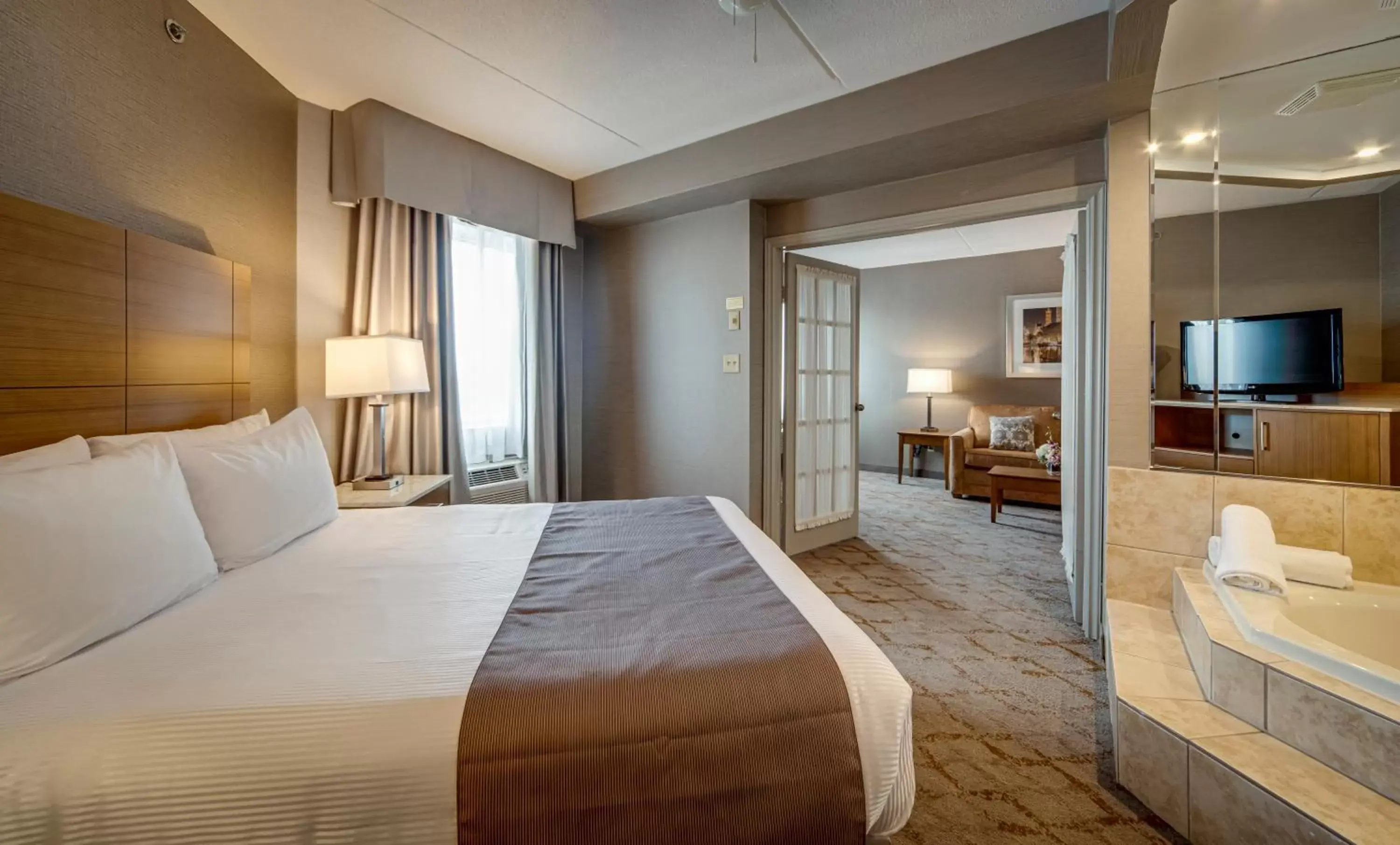 Bed in Monte Carlo Inn Vaughan Suites