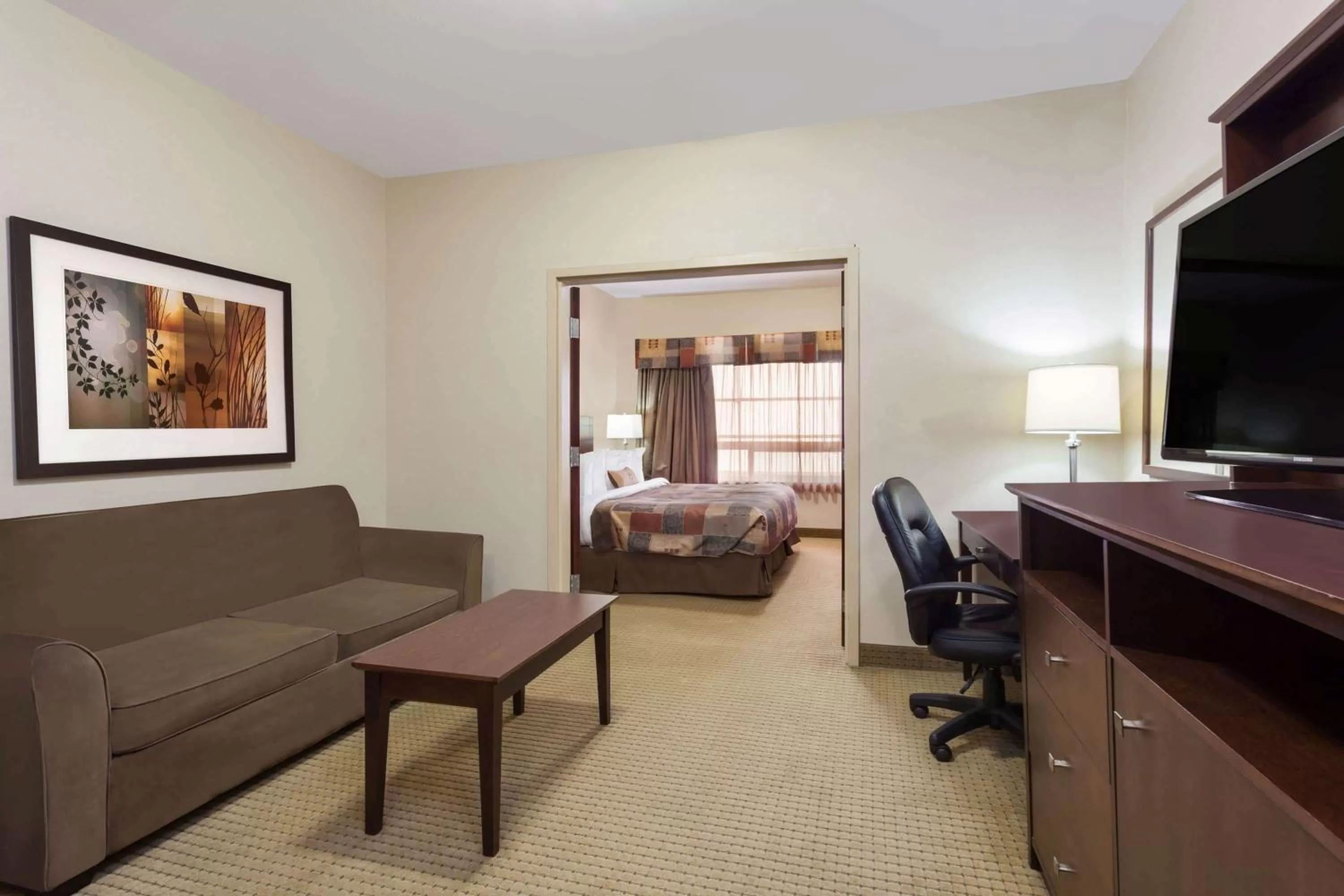 Photo of the whole room, Bed in Ramada by Wyndham Weyburn