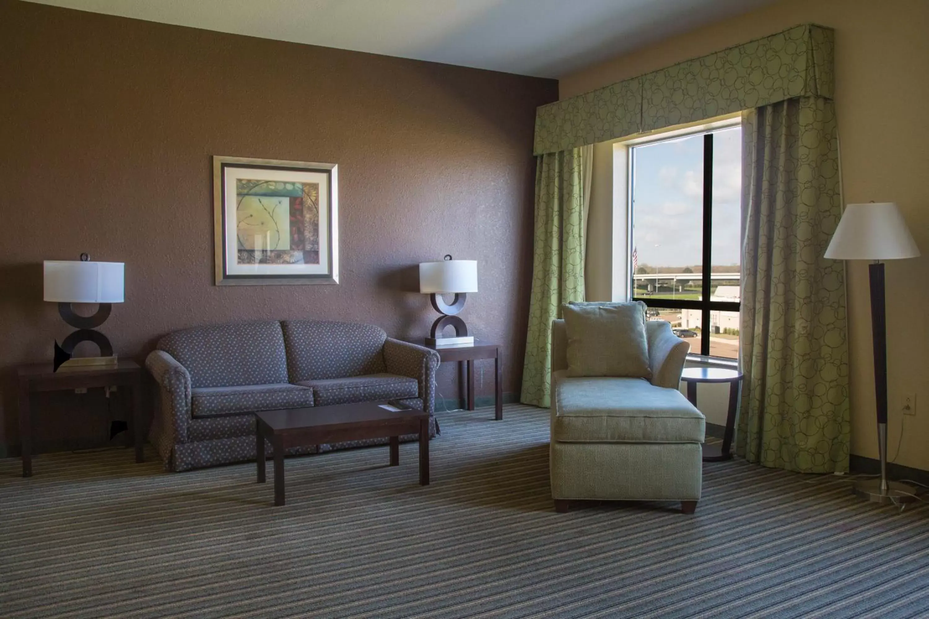 Bedroom, Seating Area in Holiday Inn Pearl - Jackson Area, an IHG Hotel