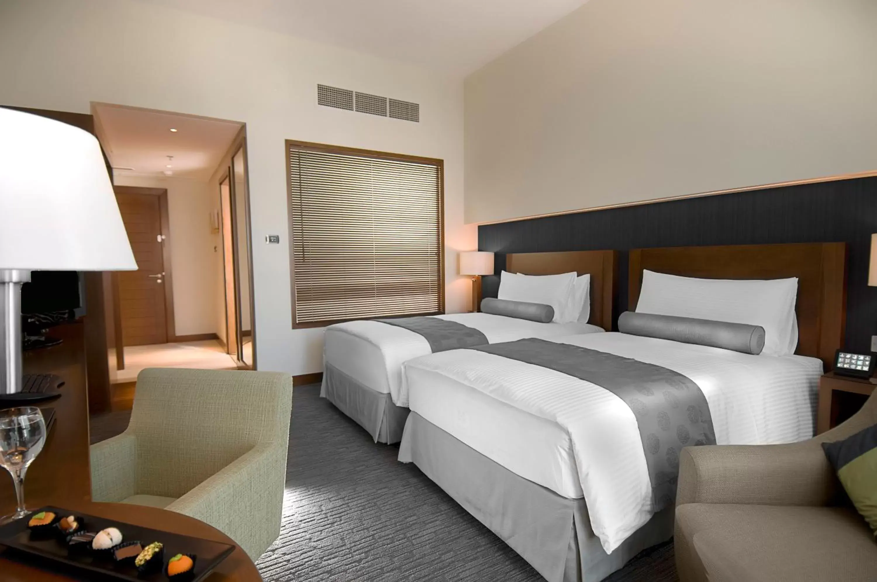 Bed in Grand Millennium Al Wahda Hotel and Executive Apartments Abu Dhabi