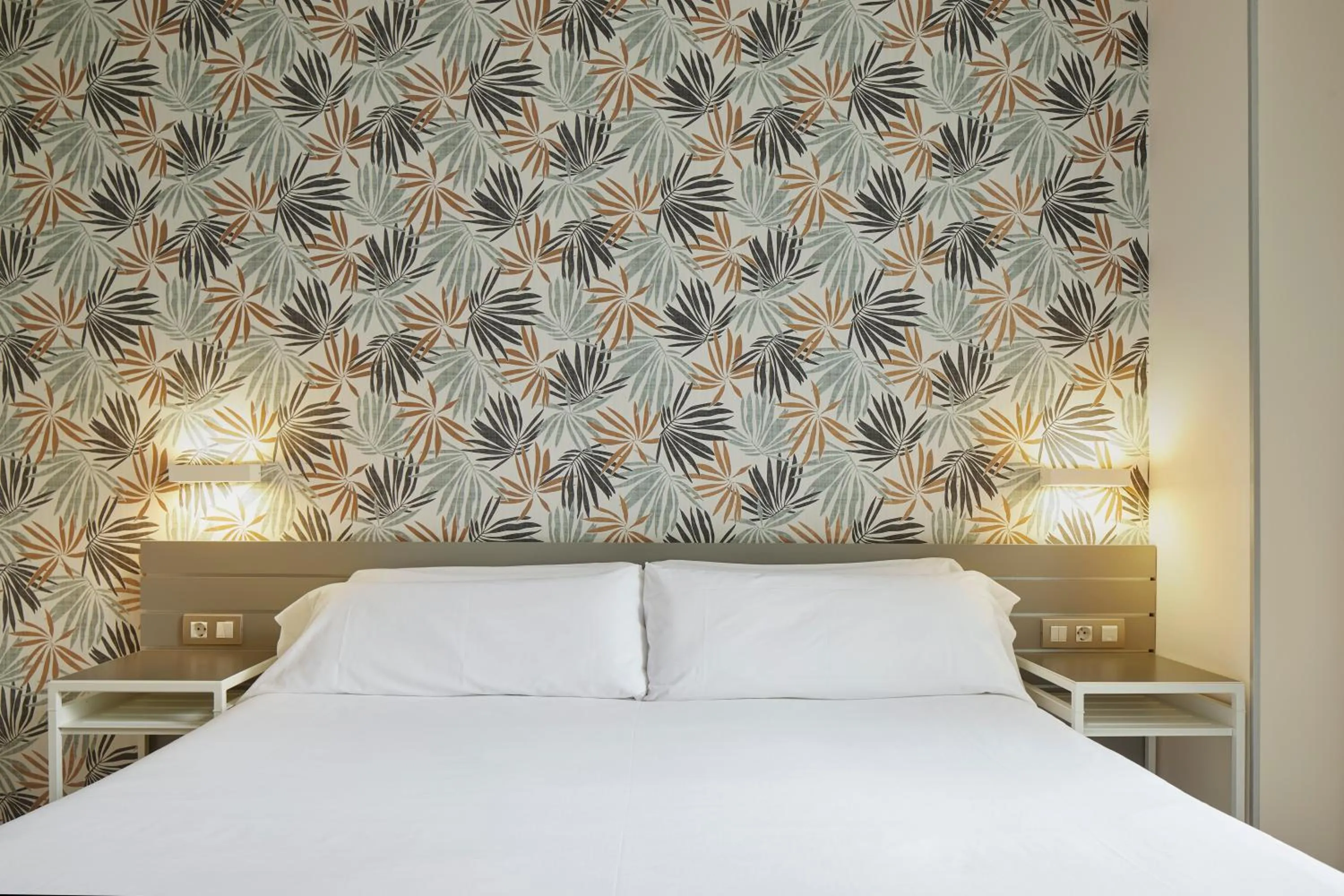 Bed in Welcome Gros Hotel