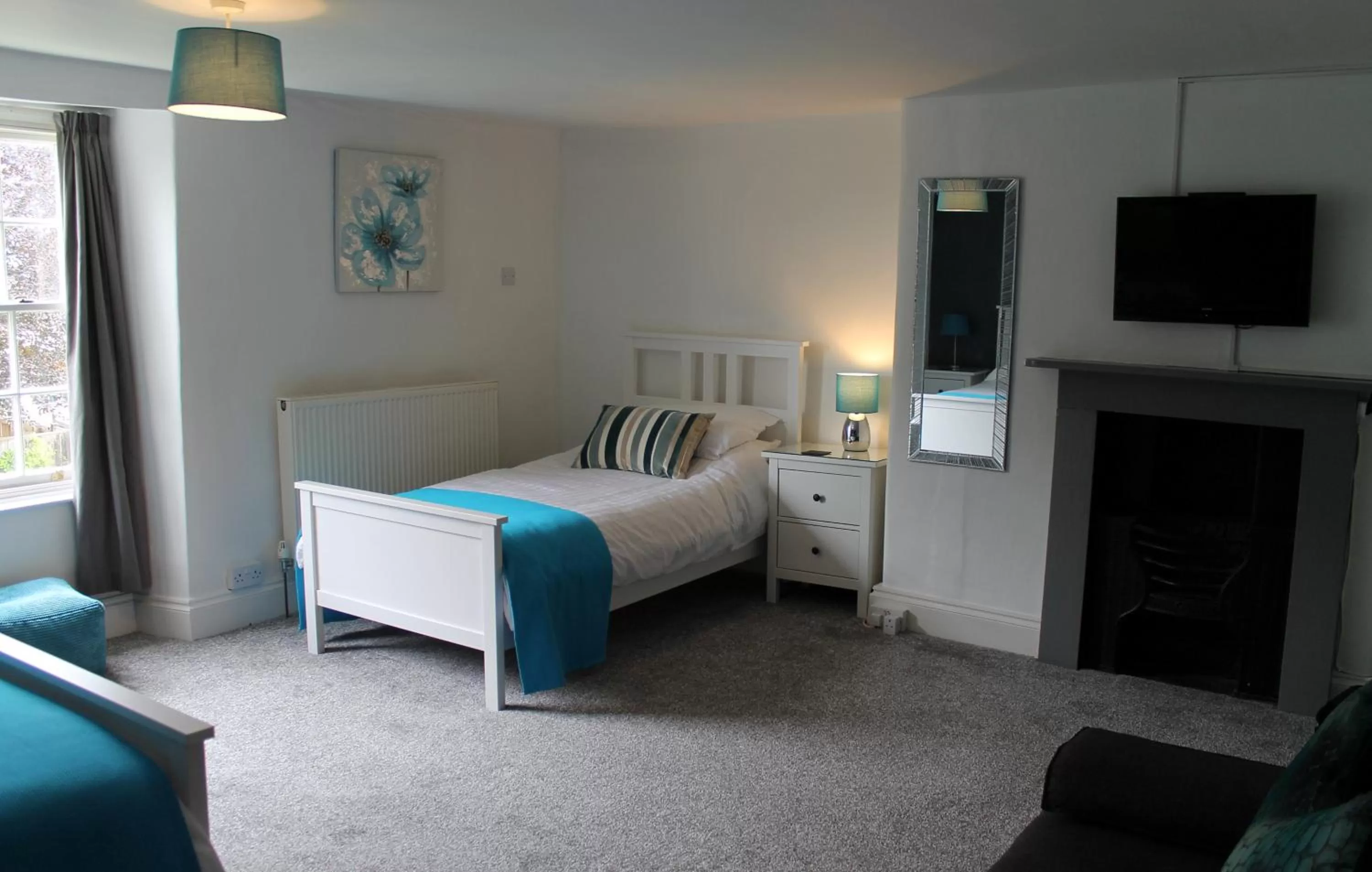 Bed in The Greyhound Inn