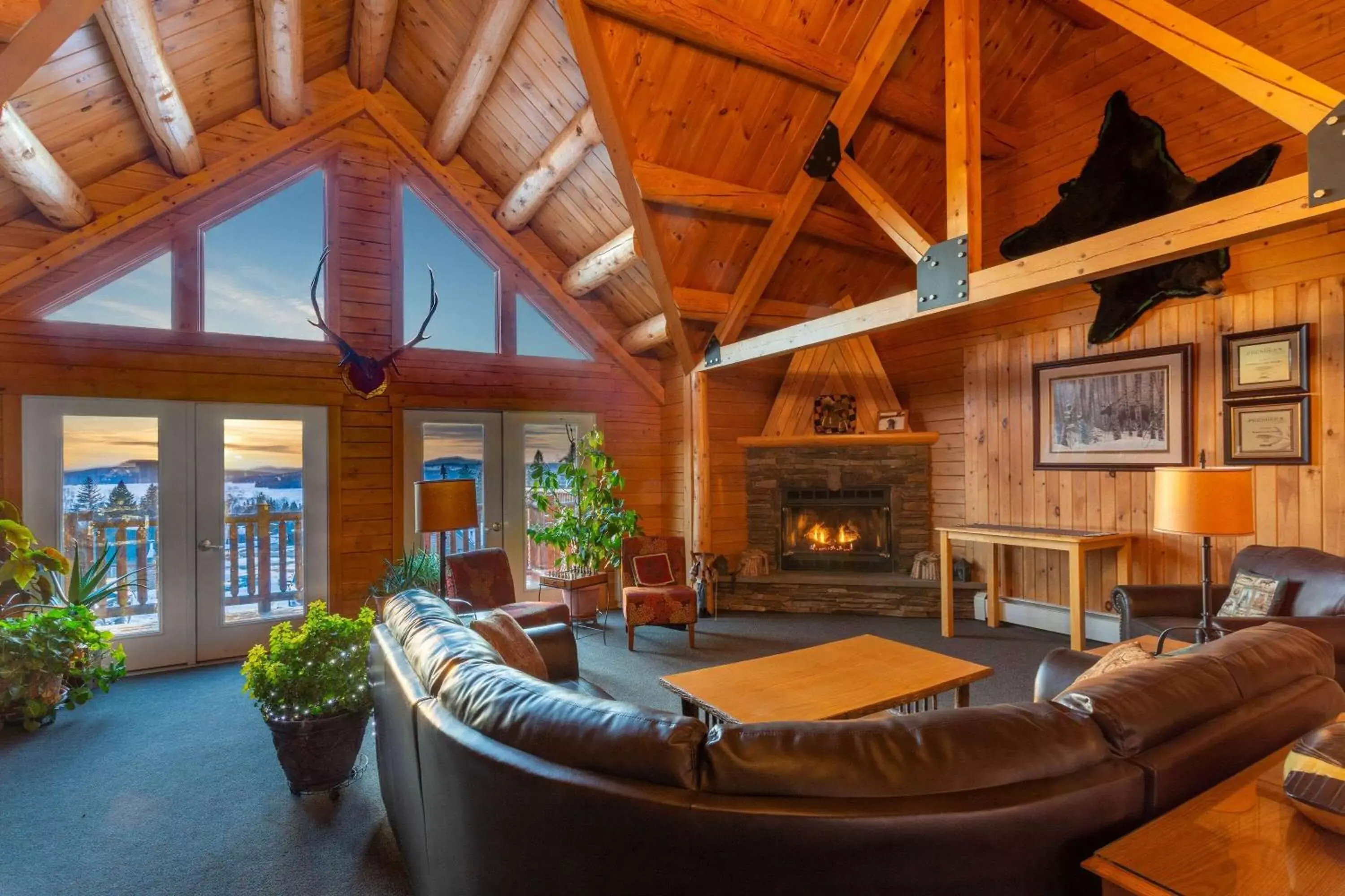 Bed, Seating Area in Rangeley Lake Resort a Ramada by Wyndham