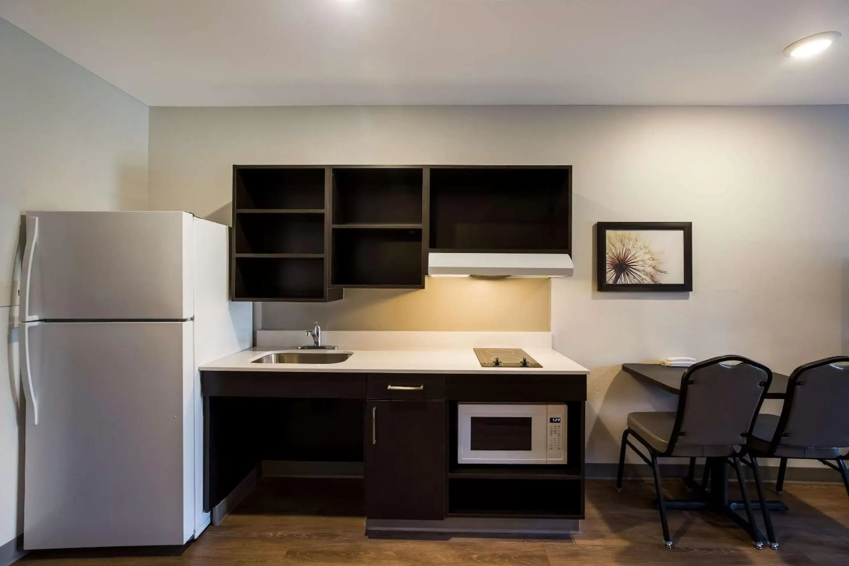 Bedroom, Kitchen/Kitchenette in WoodSpring Suites Orlando West - Clermont