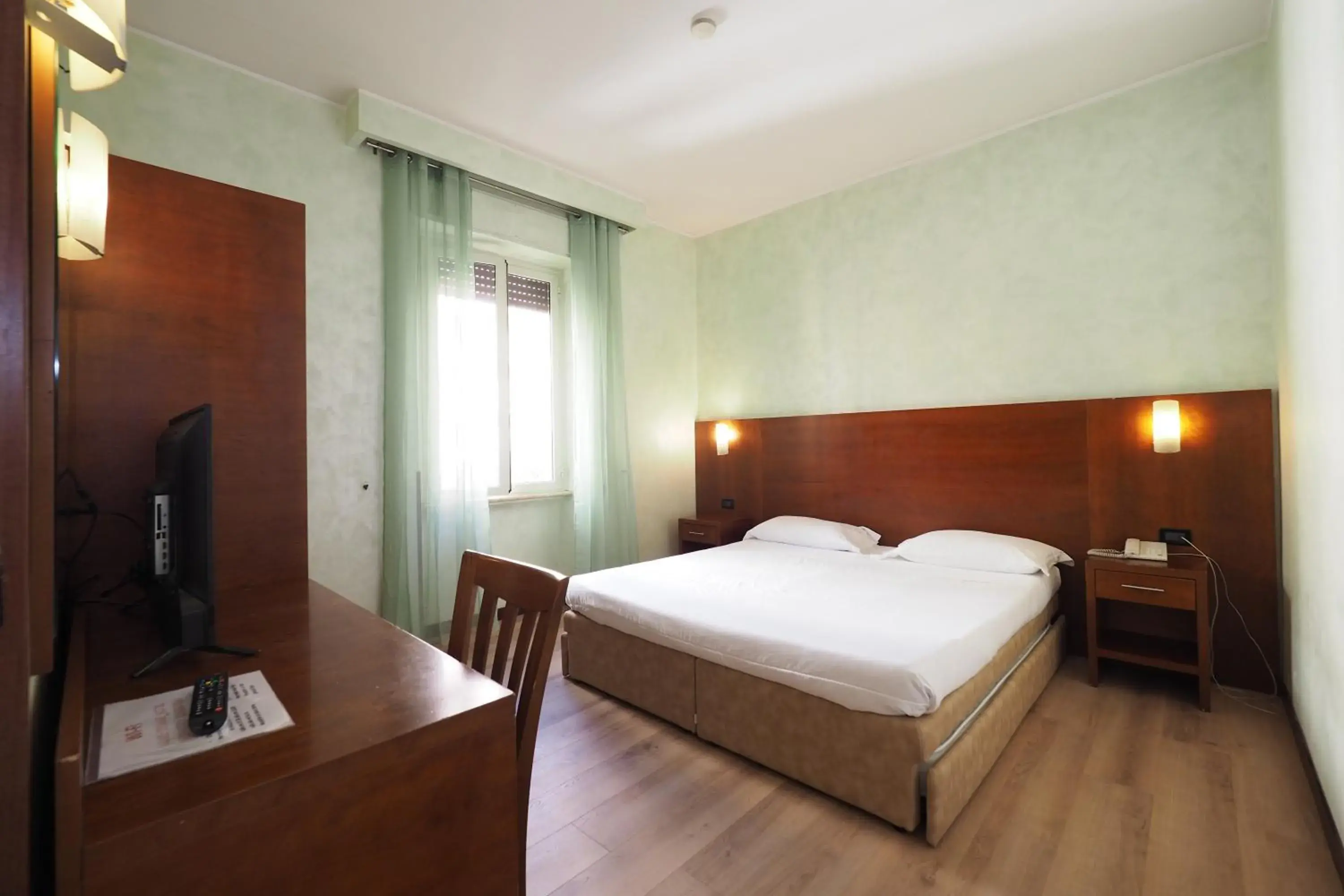 Bed in Hotel Osimar
