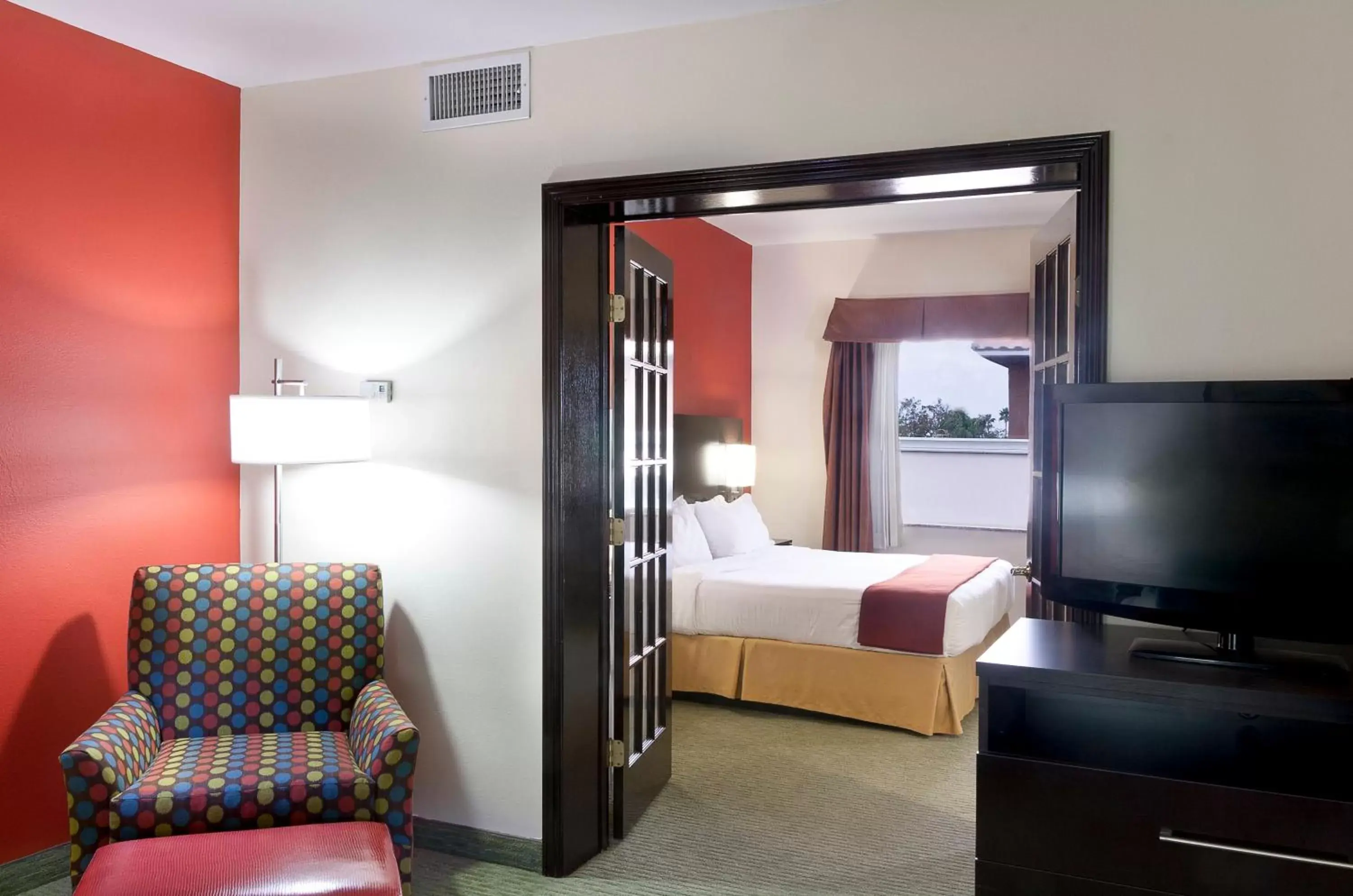 Bedroom, Seating Area in Holiday Inn Express Hotel and Suites Brownsville, an IHG Hotel