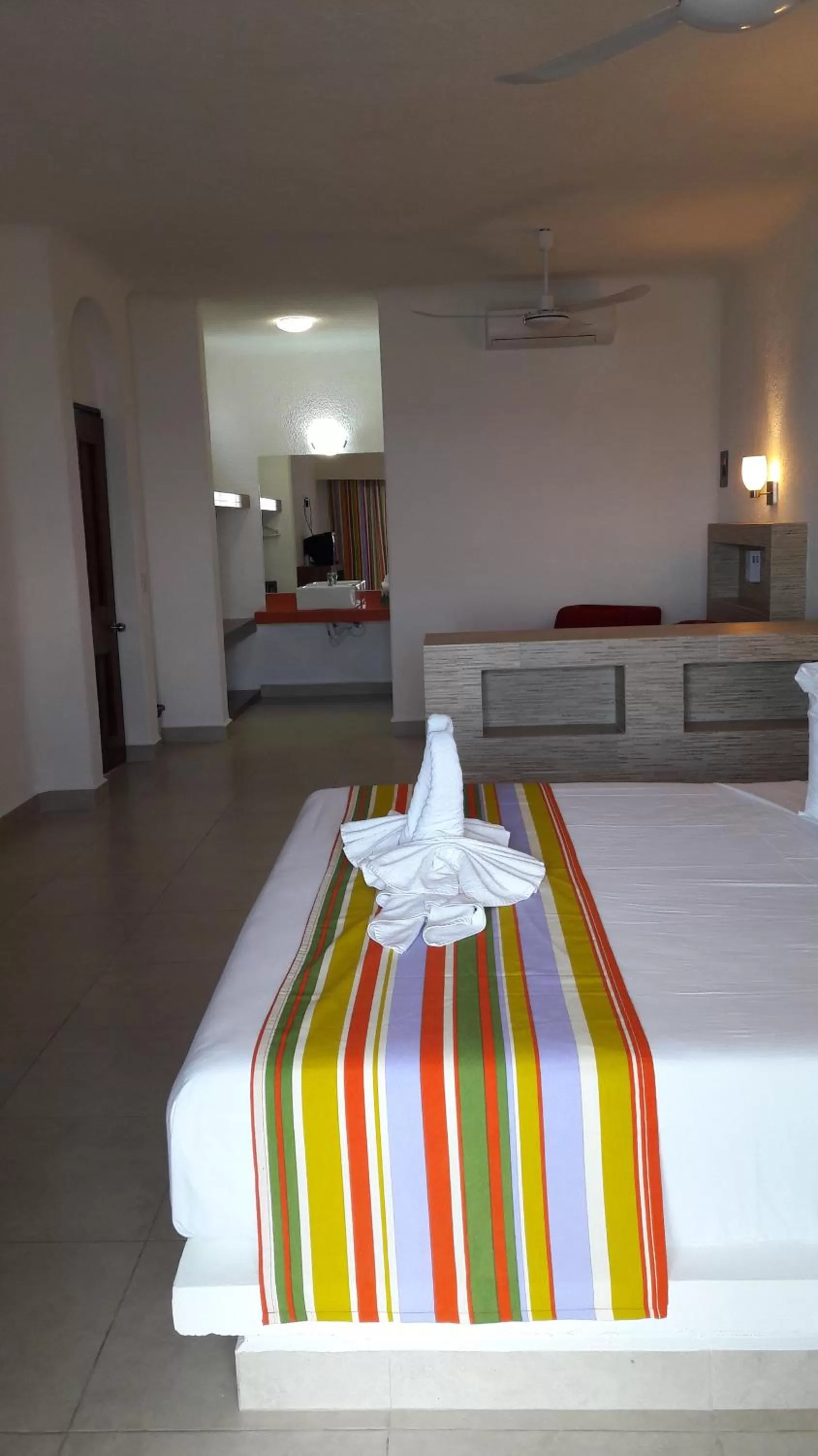 Photo of the whole room, Bed in Pelicano Inn Playa del Carmen - Beachfront Hotel