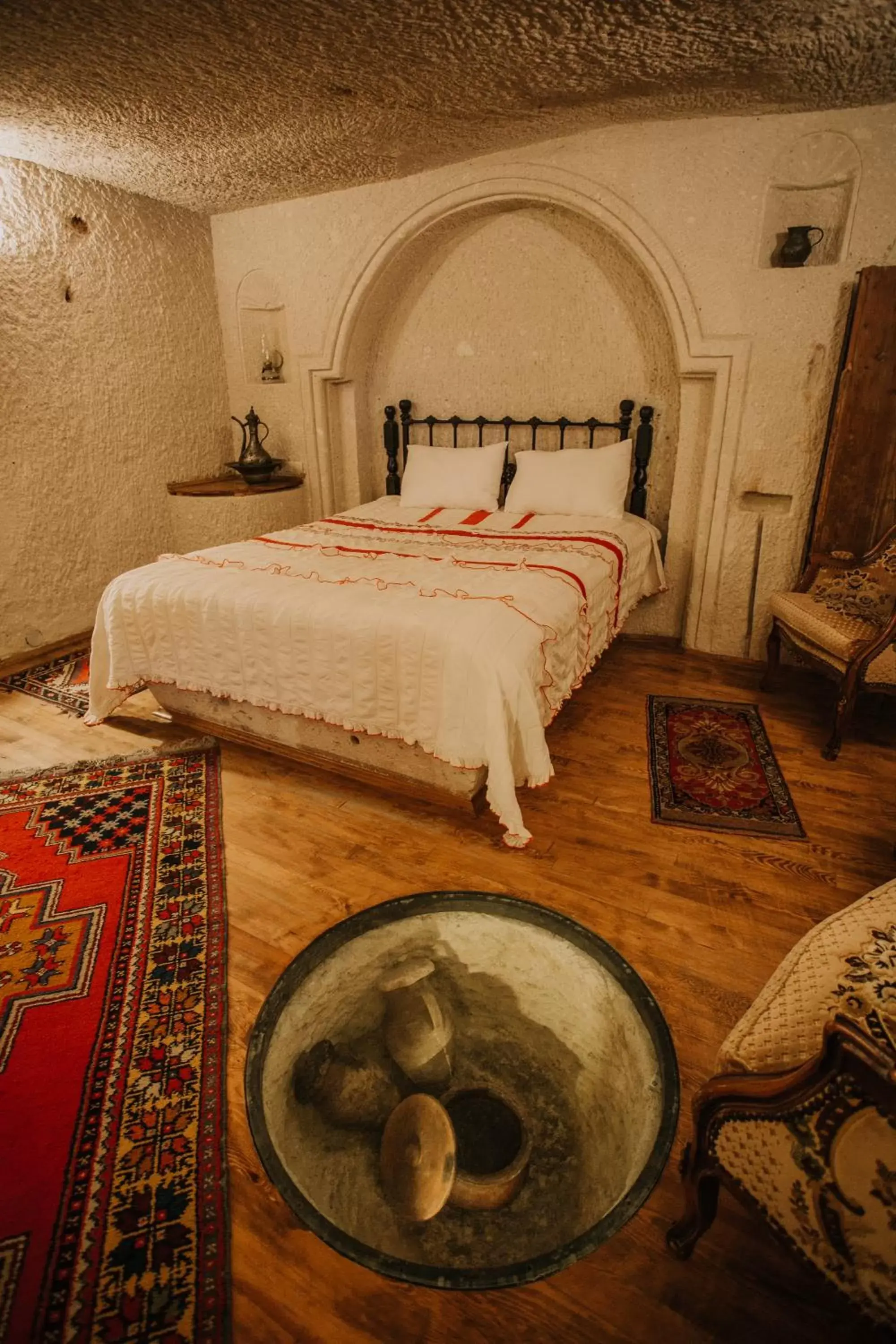 Bed in Village Cave House Hotel