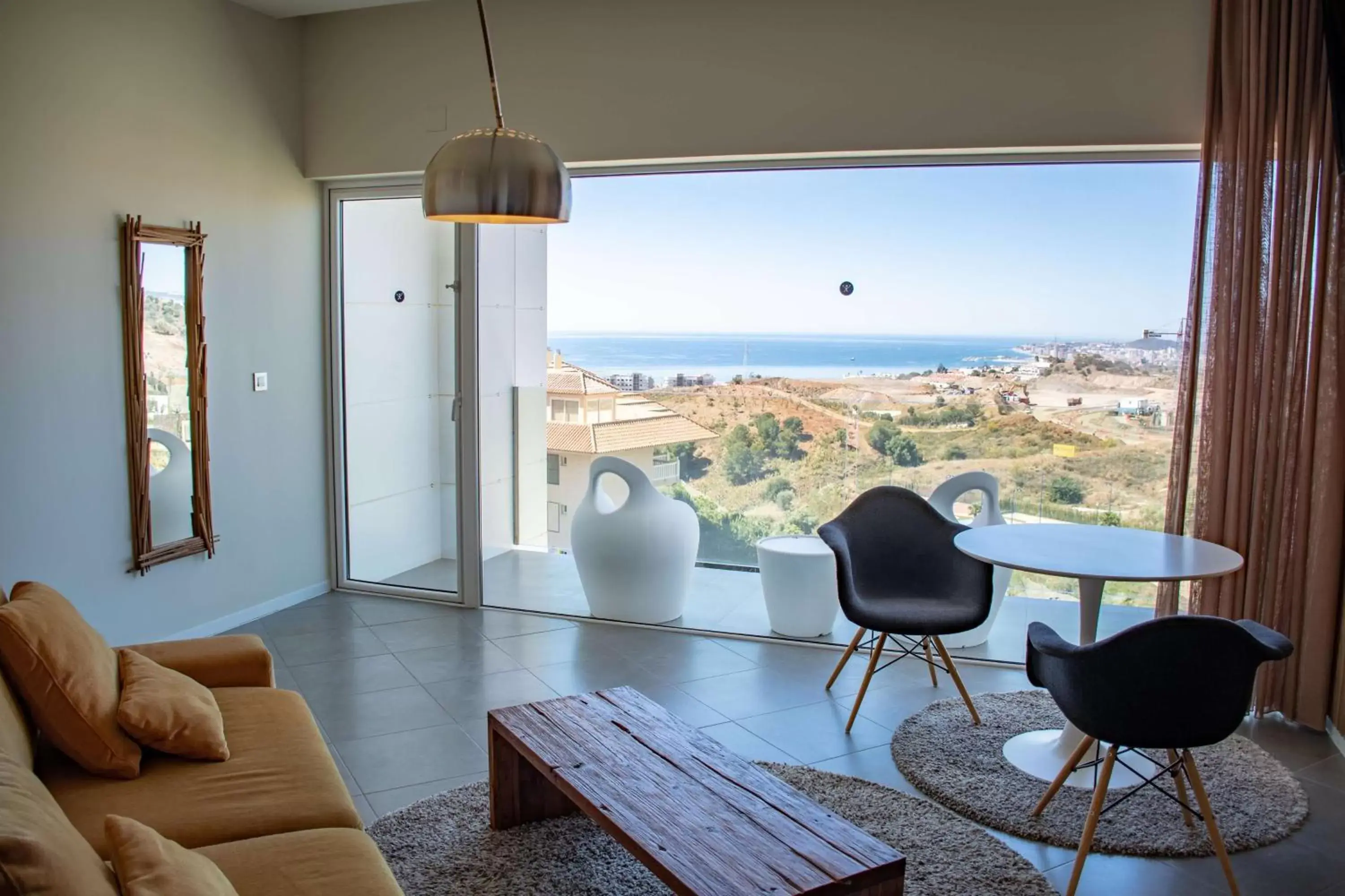 Living room, Seating Area in Higuerón Hotel Curio Collection by Hilton