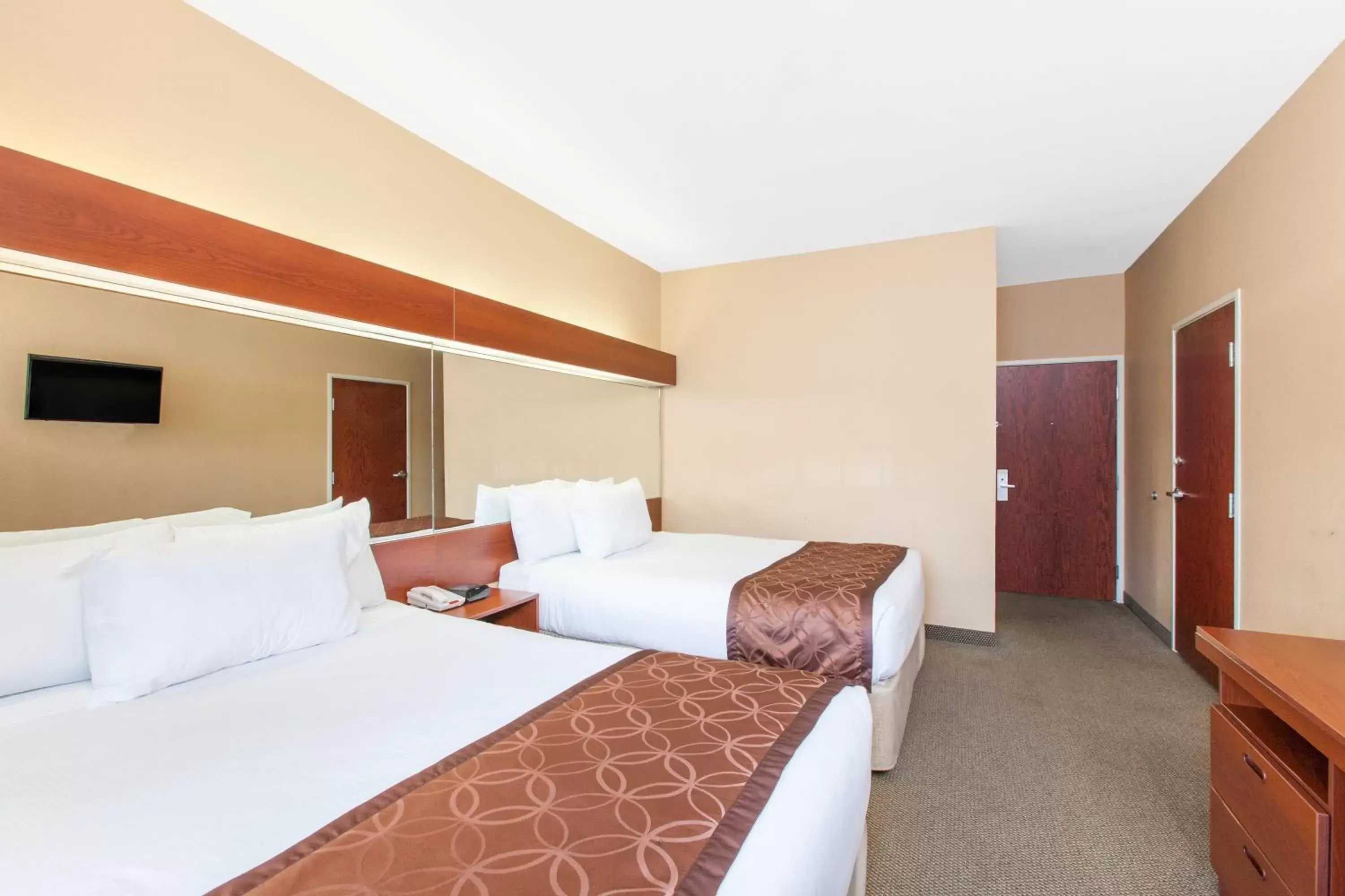 Bed in Microtel Inn by Wyndham Rogers
