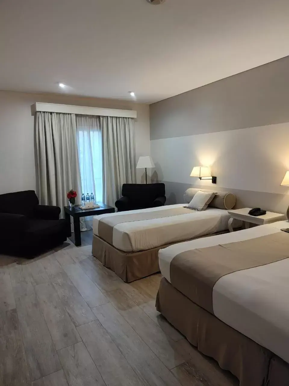 Bed in Loi Suites Recoleta Hotel