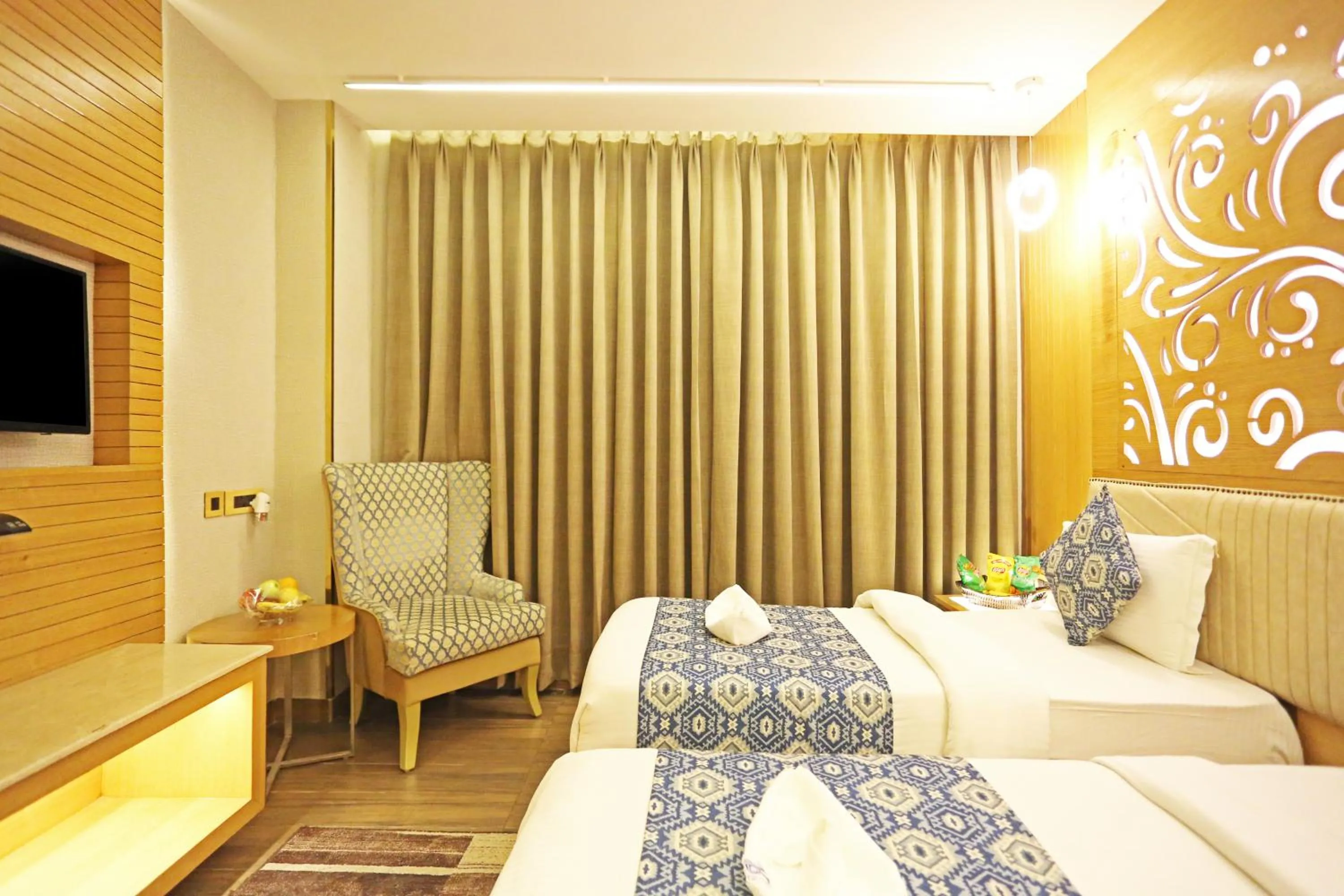 Bed in JRD Luxury-Business Hotel