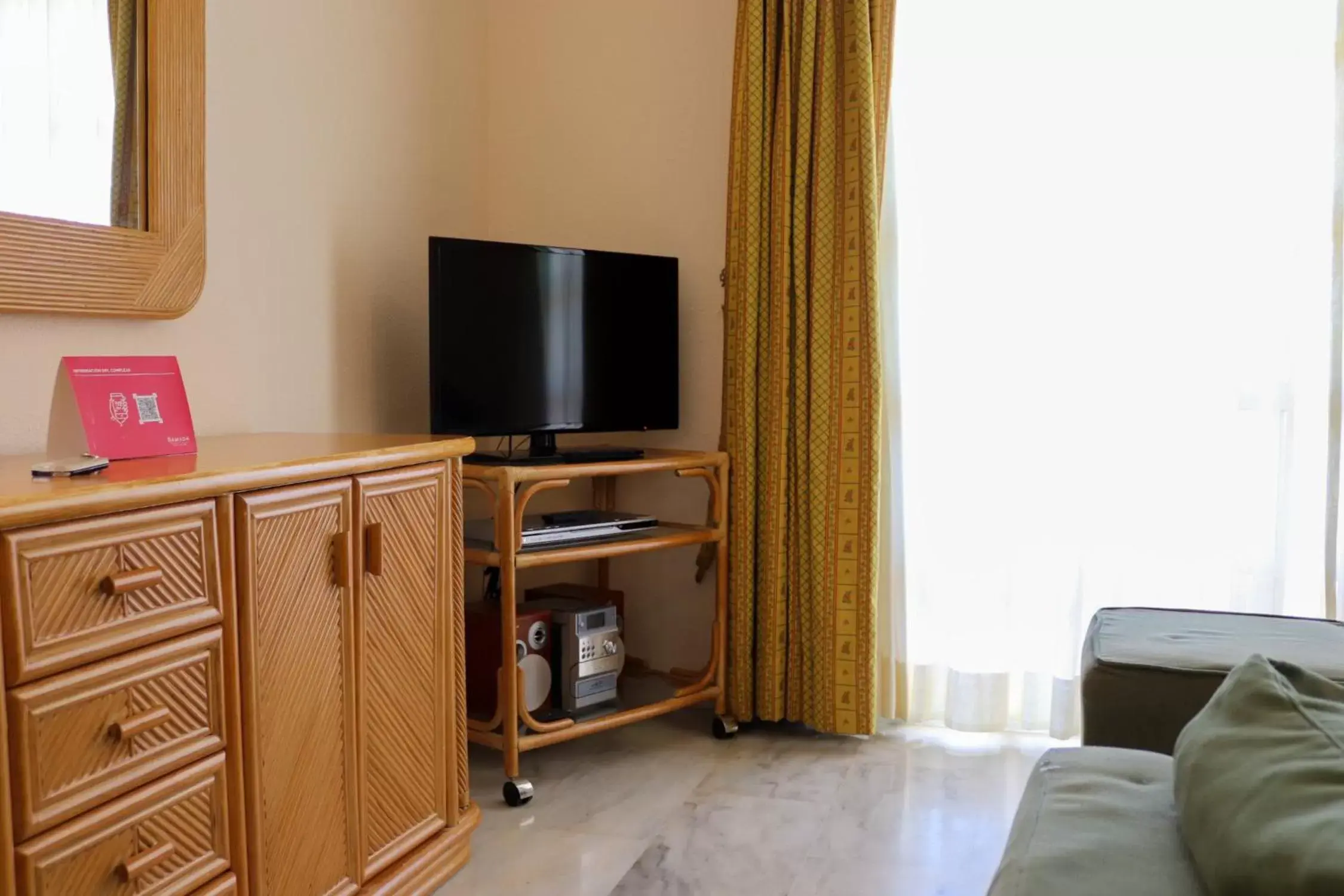 TV and multimedia, TV/Entertainment Center in Ramada Hotel & Suites by Wyndham Costa del Sol