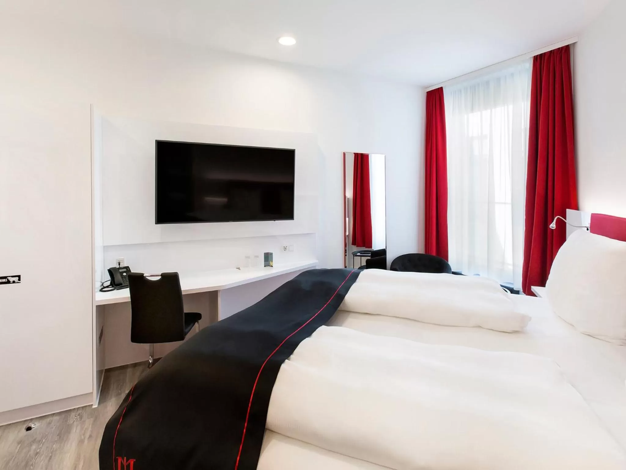 Bed in DORMERO Hotel Roth