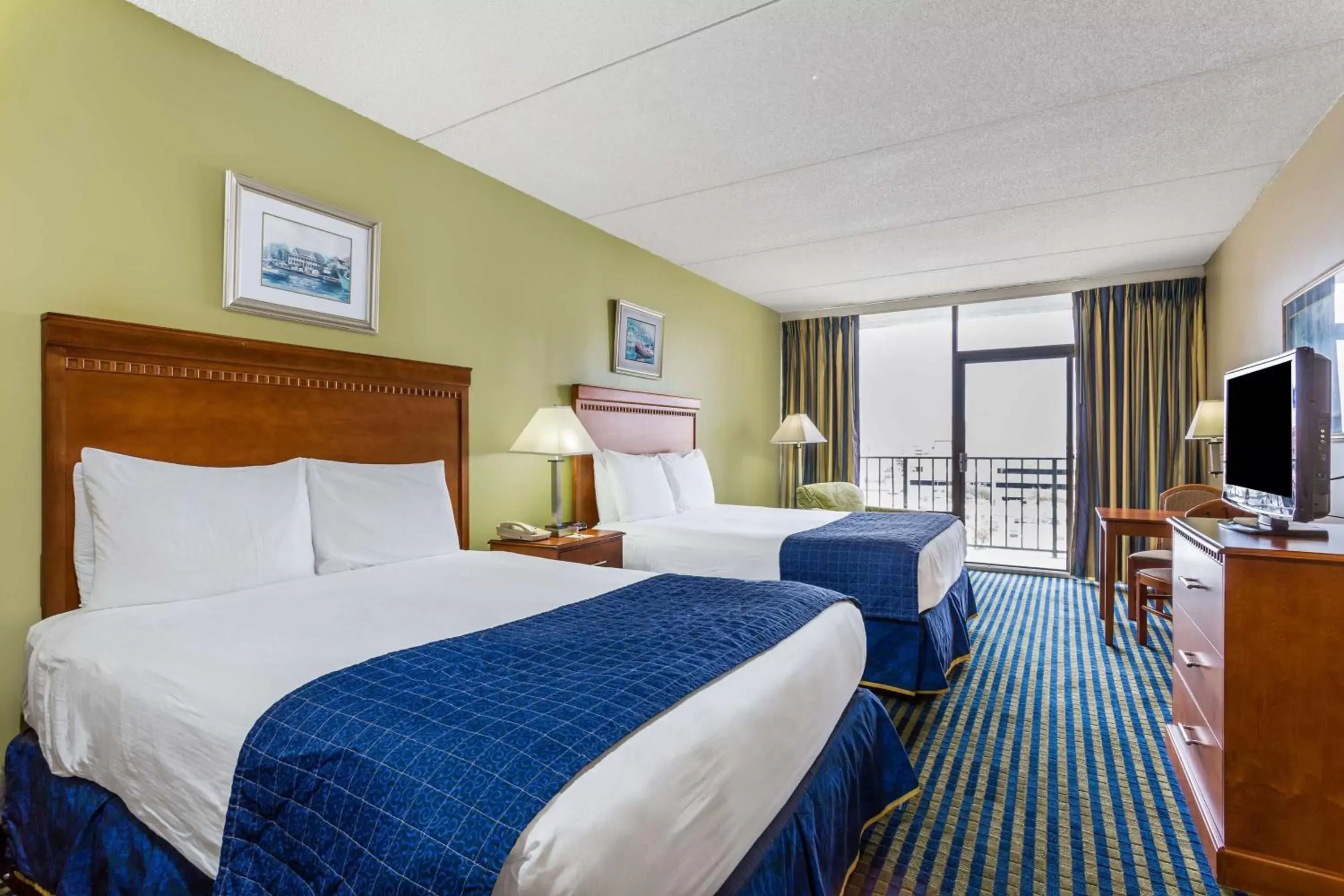 Queen Room with Two Queen Beds - Non-Smoking in Days Inn by Wyndham Virginia Beach At The Beach
