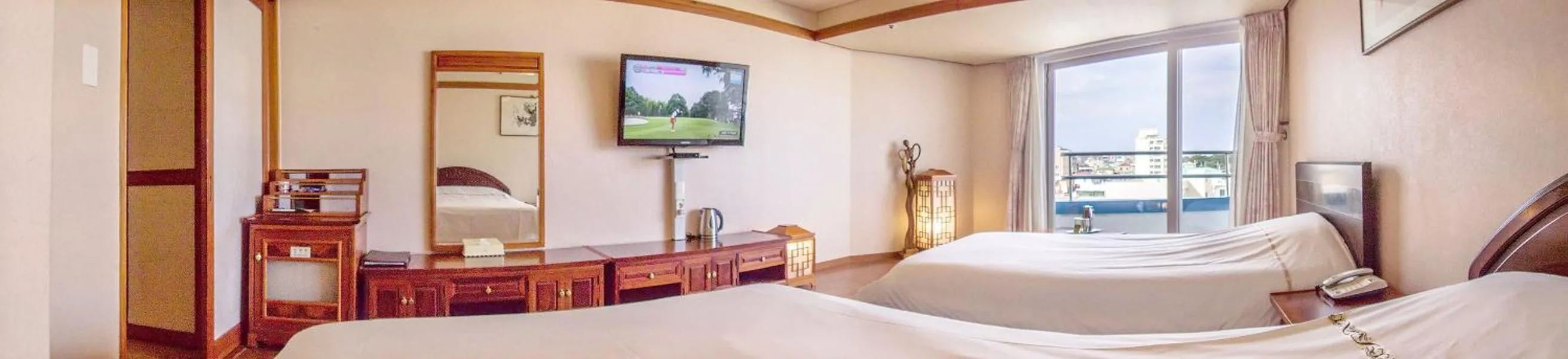 Bed in Jeju Pacific Hotel