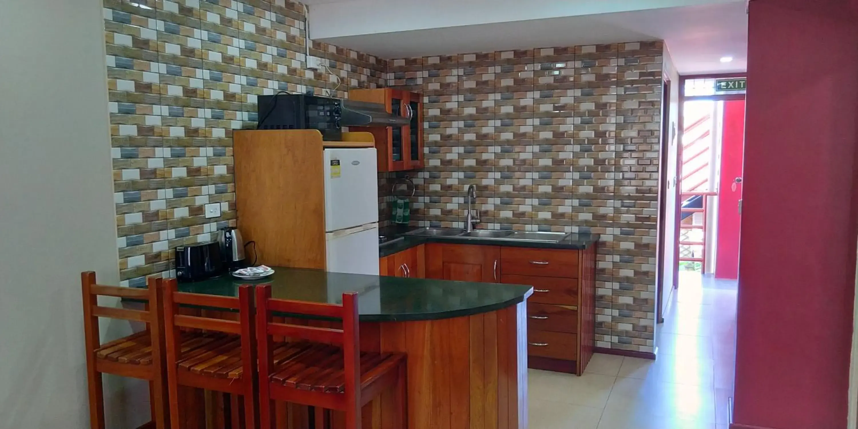 Kitchen/Kitchenette in Al - Minhaj Service Apartments