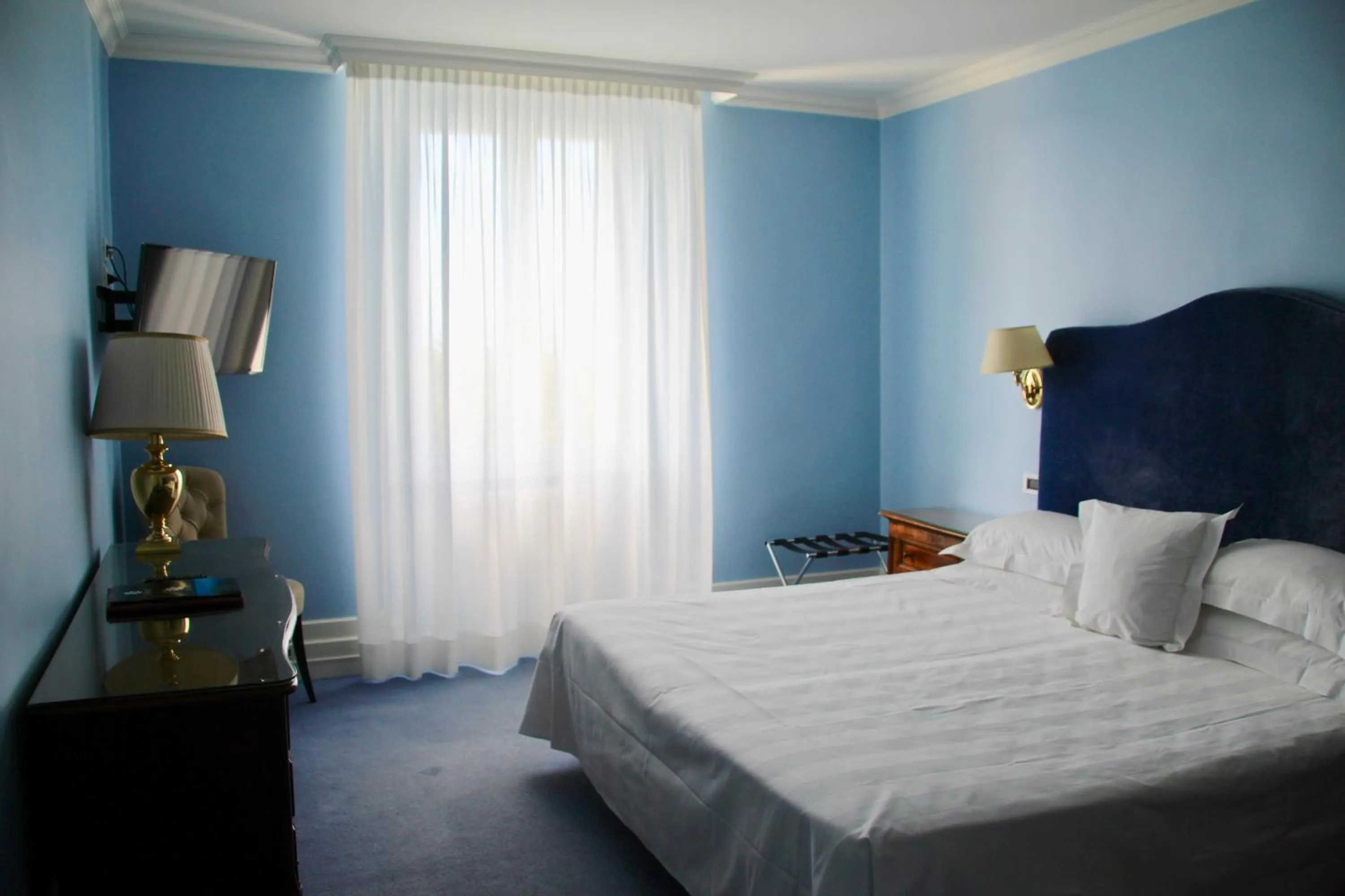 Bed in Hotel Riviera & Maximilian's