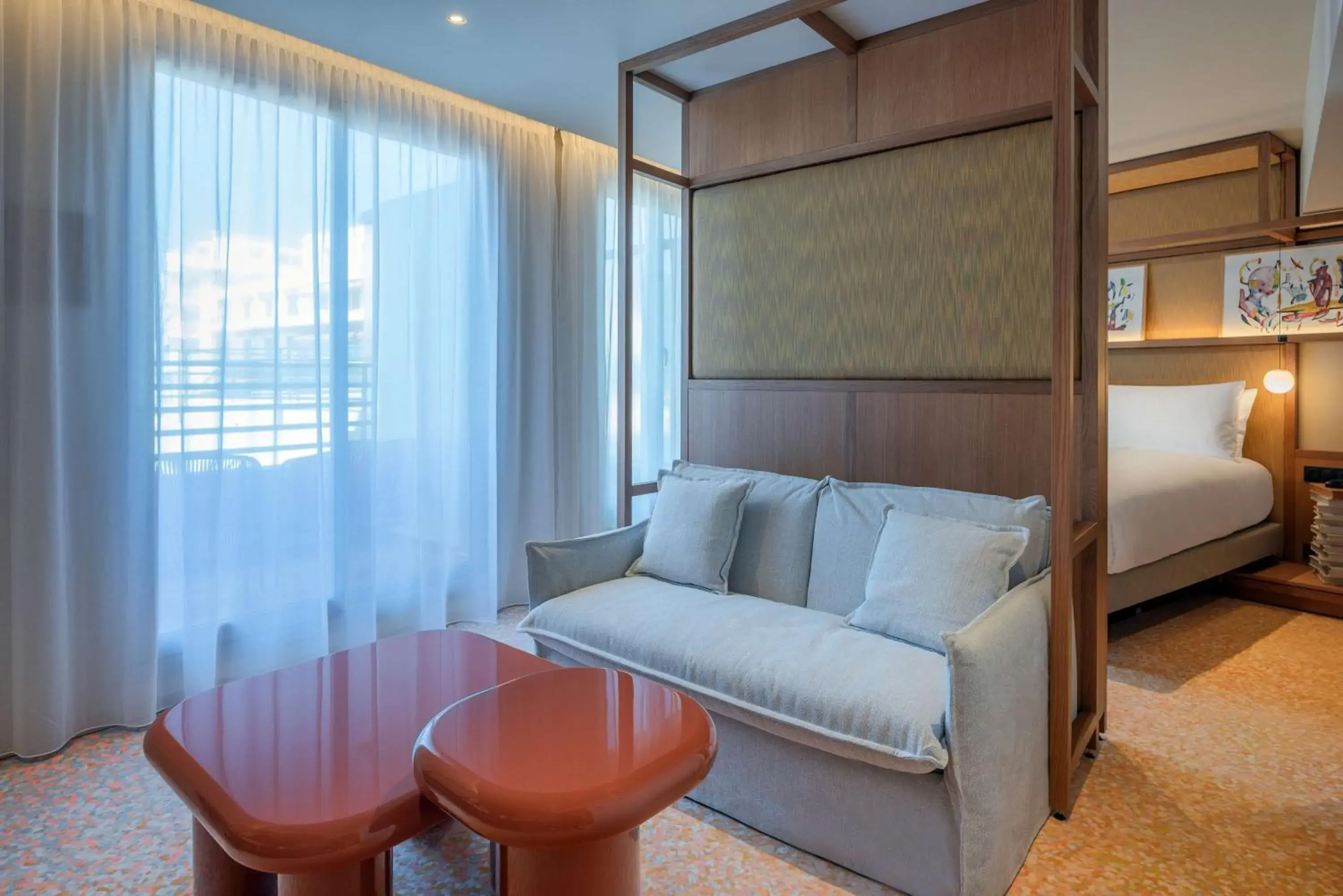 Bed, Seating Area in Canopy by Hilton Cannes