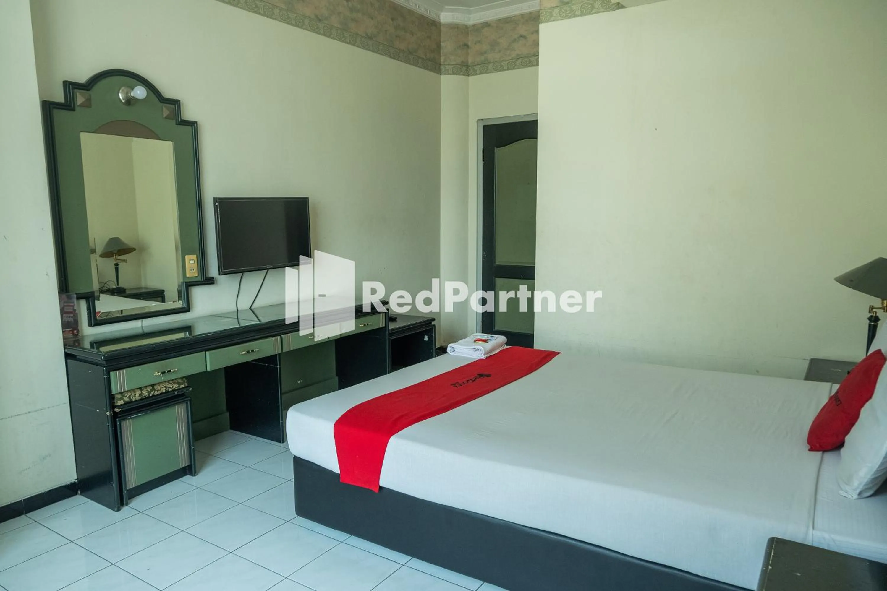 Bed in Akur Hotel Malioboro Mitra RedDoorz