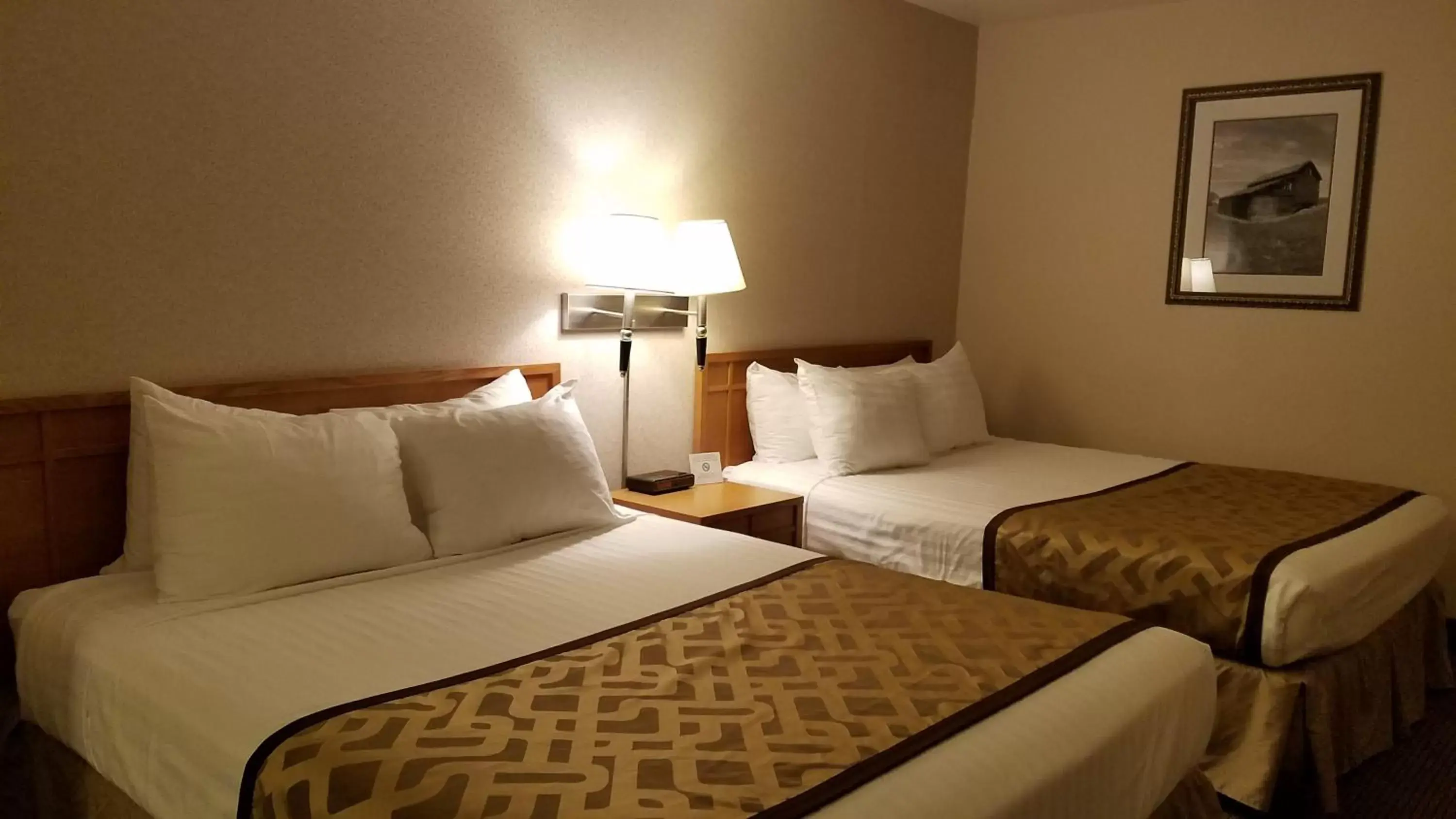 Bed in RiverTree Inn & Suites