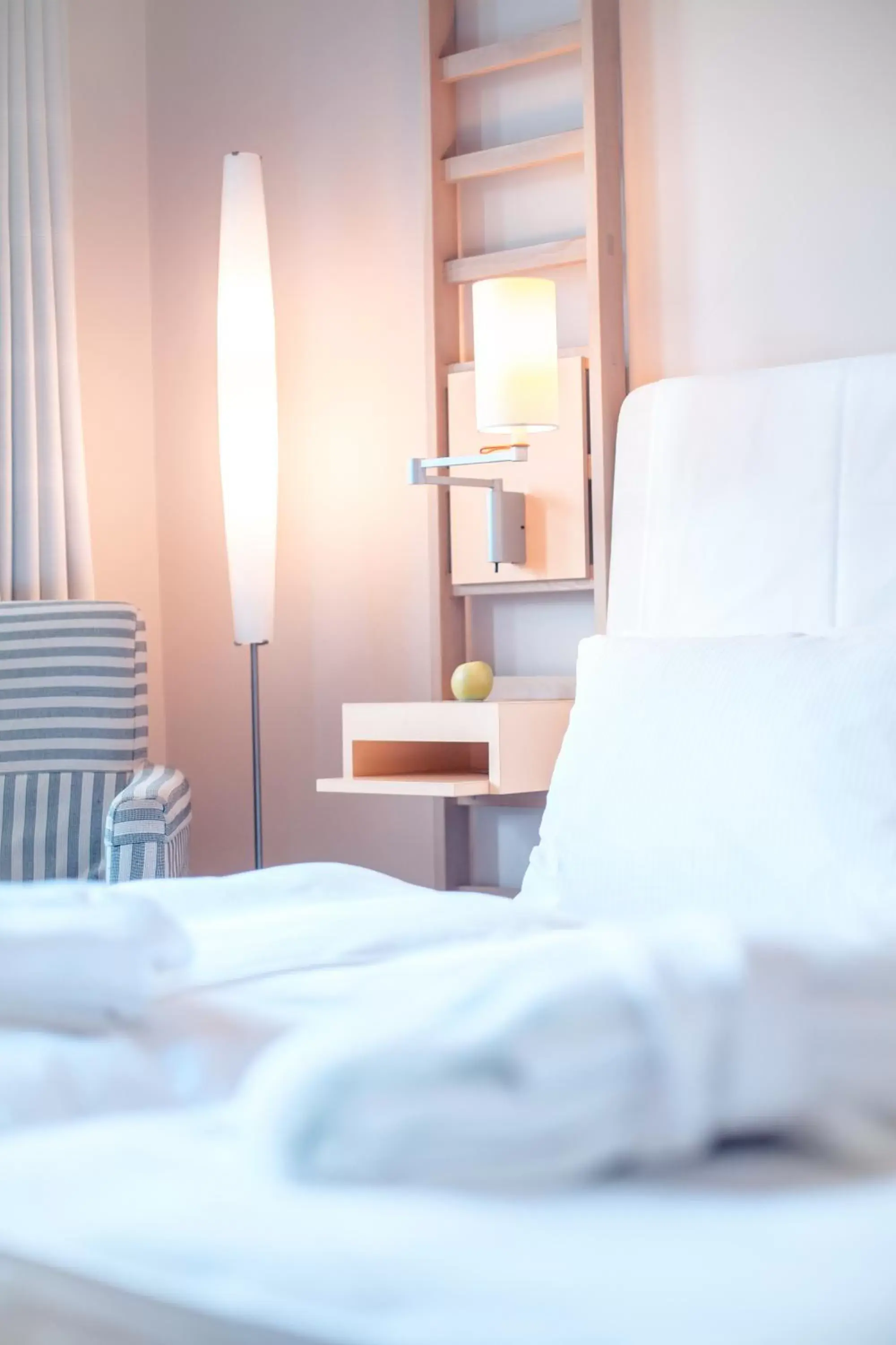 Bed, Seating Area in Hotel Bleibtreu Berlin by Golden Tulip