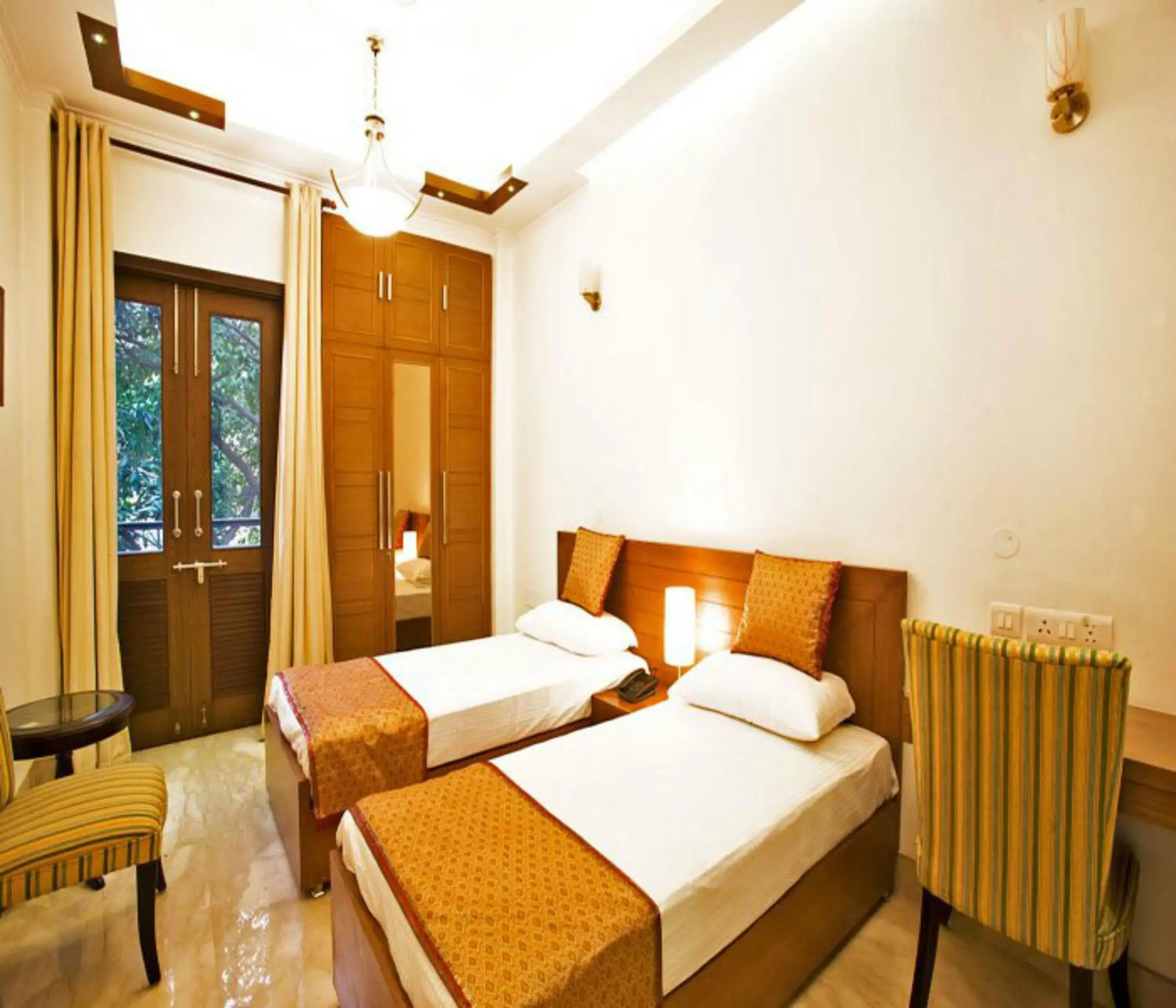 Bed in Evergreen Suites Defence Colony