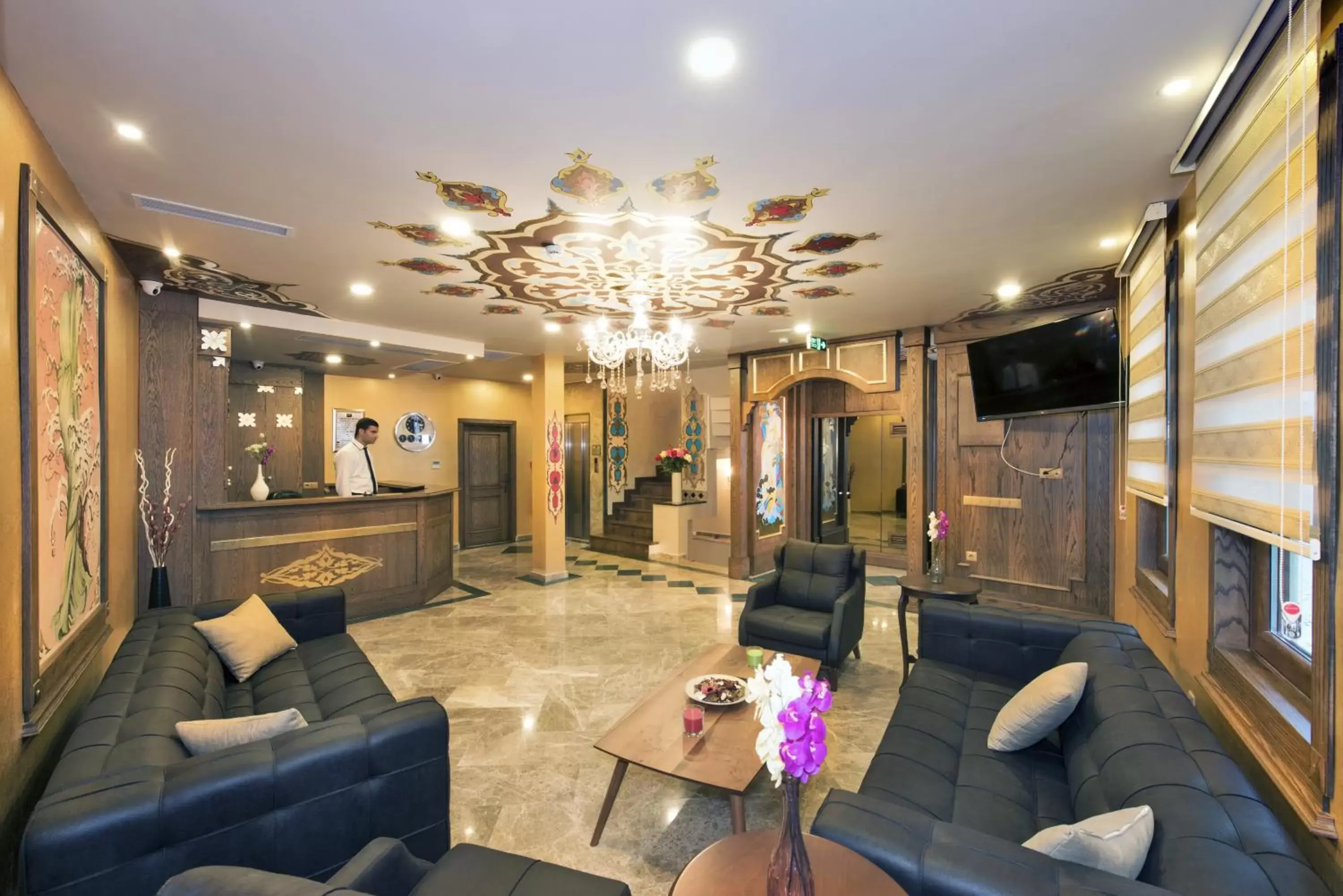 Communal lounge/ TV room, Seating Area in Perapolis Hotel