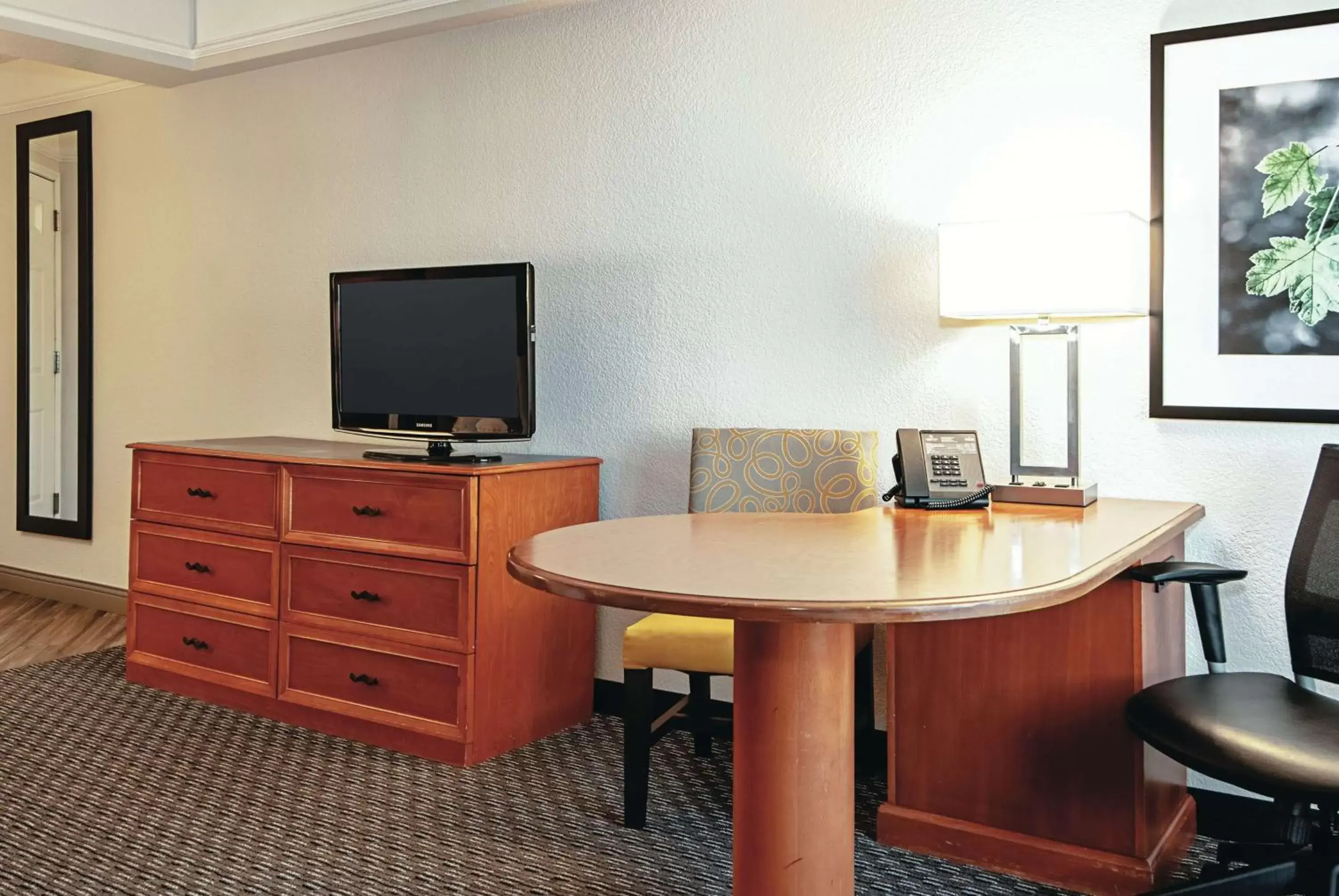 Photo of the whole room, TV/Entertainment Center in La Quinta by Wyndham Ontario Airport