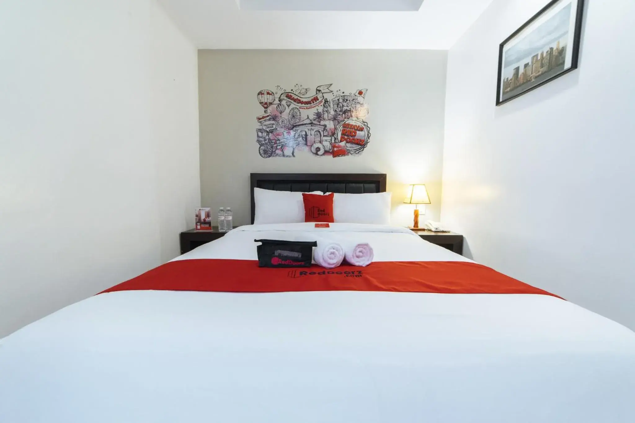 Bedroom, Bed in RedDoorz Plus at One Liberty Hotel Kalayaan Avenue