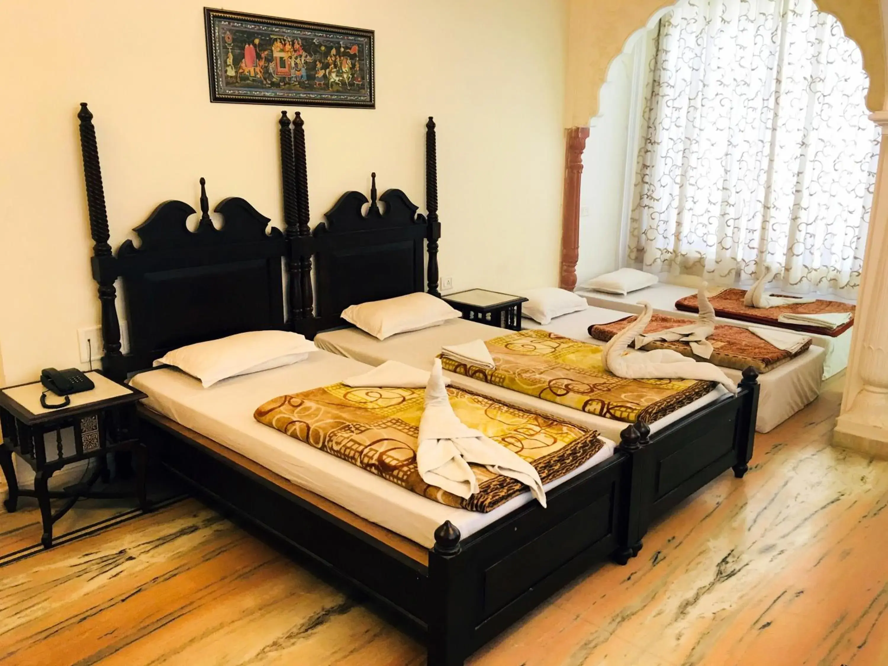 Bed in Krishna Palace - A Heritage Hotel