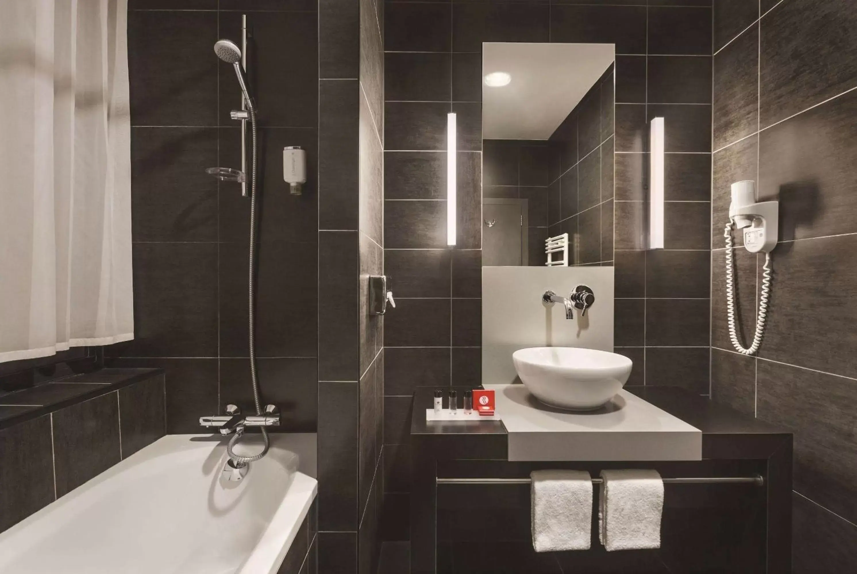 TV and multimedia, Bathroom in Hotel Ramada Brussels Woluwe