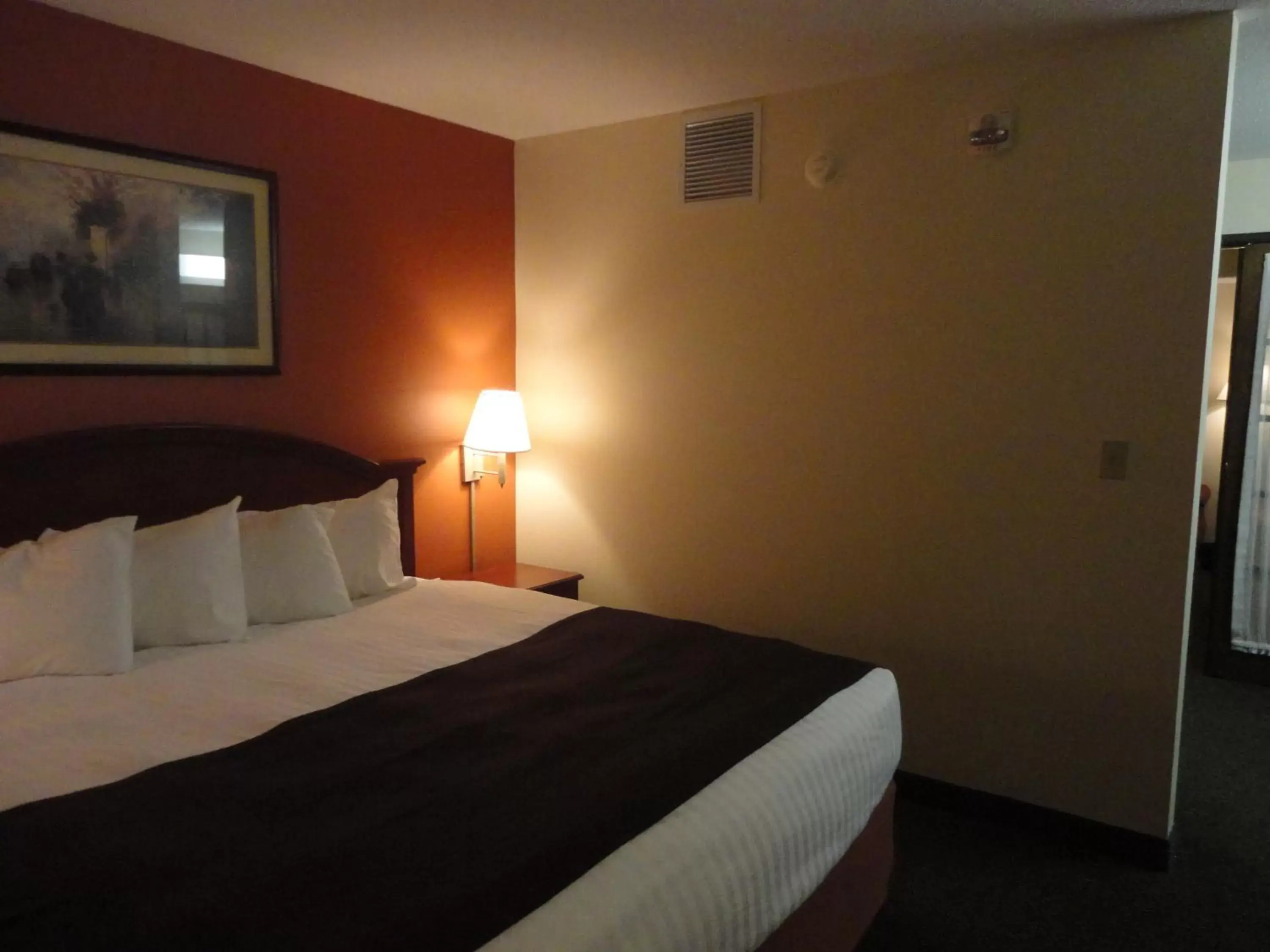 Bed in AmericInn by Wyndham Ottumwa